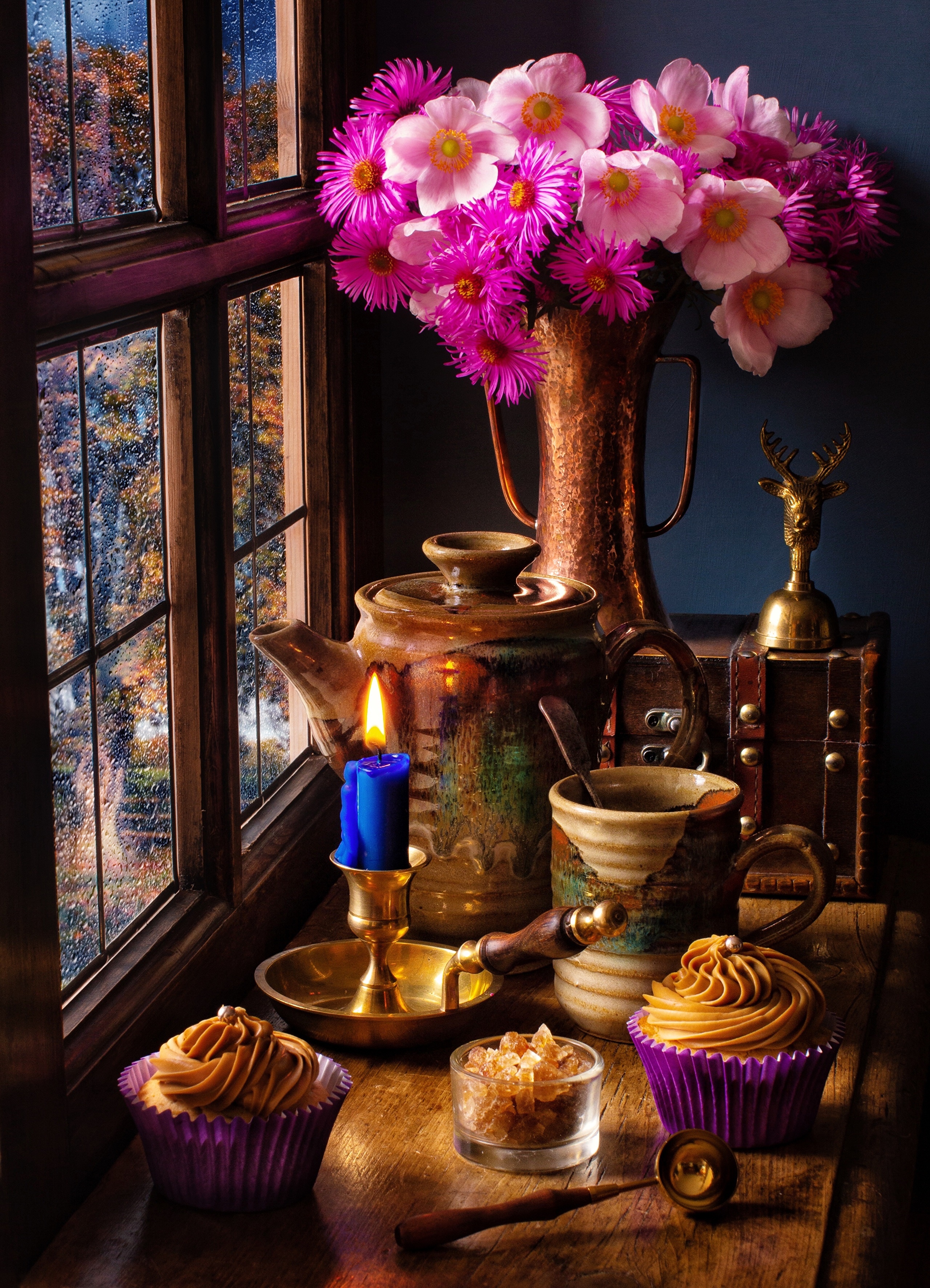 Still life with flowers, cupcakes, and candle by the window HD Phone Wallpaper