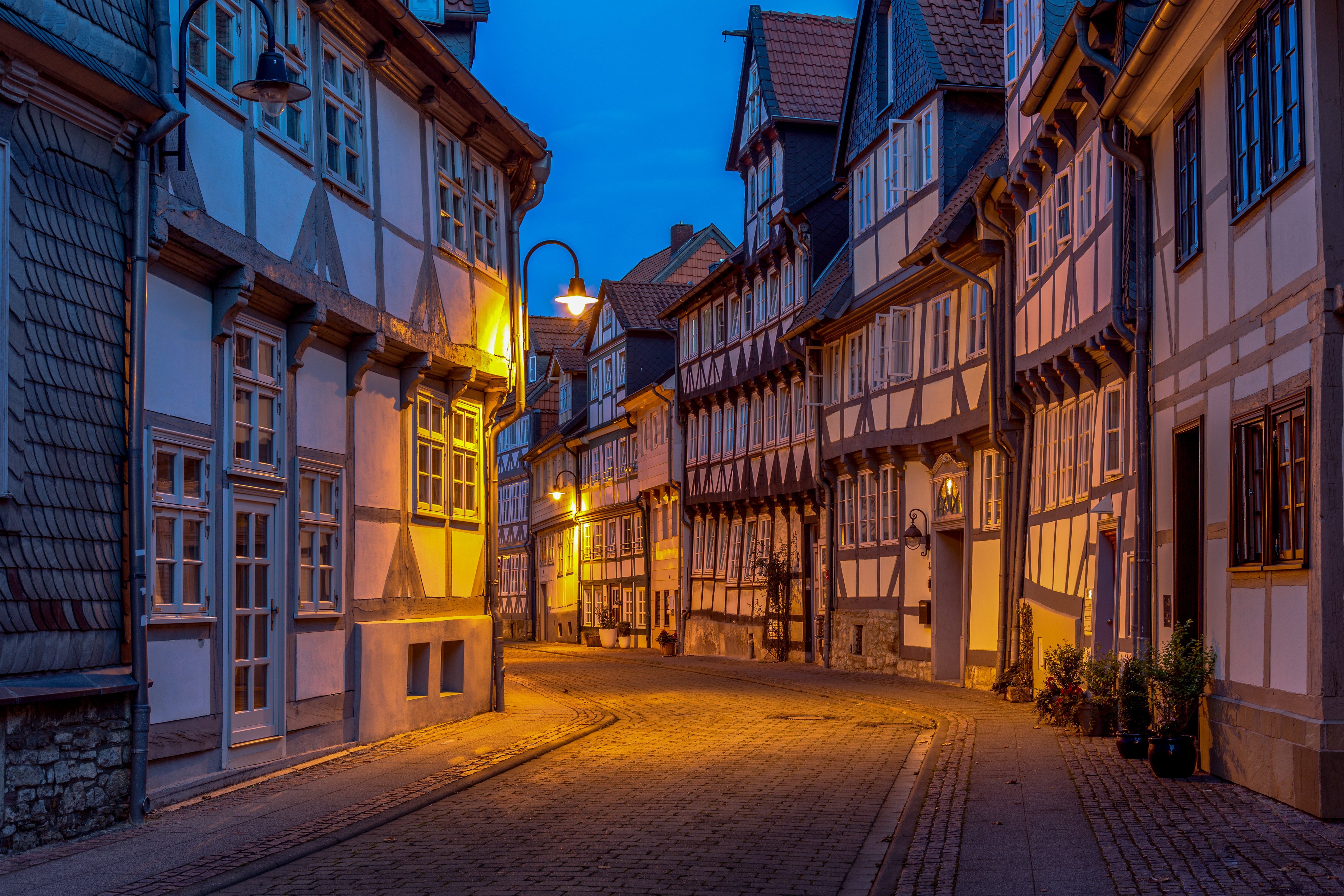 Street with half-timbered houses in Germany at dusk HD Wallpaper