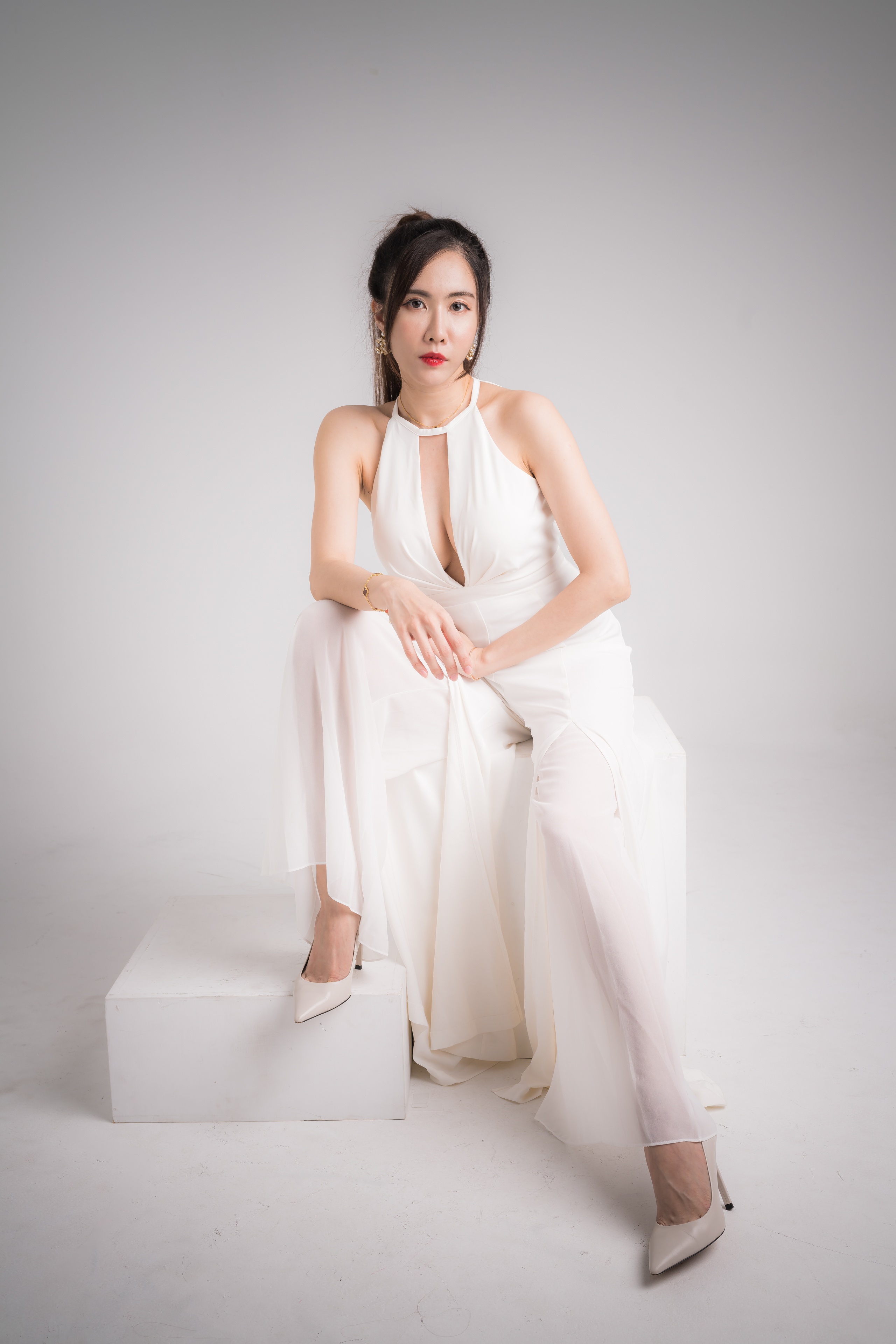 Asian woman in white dress posing on a stool HD Phone Wallpaper
