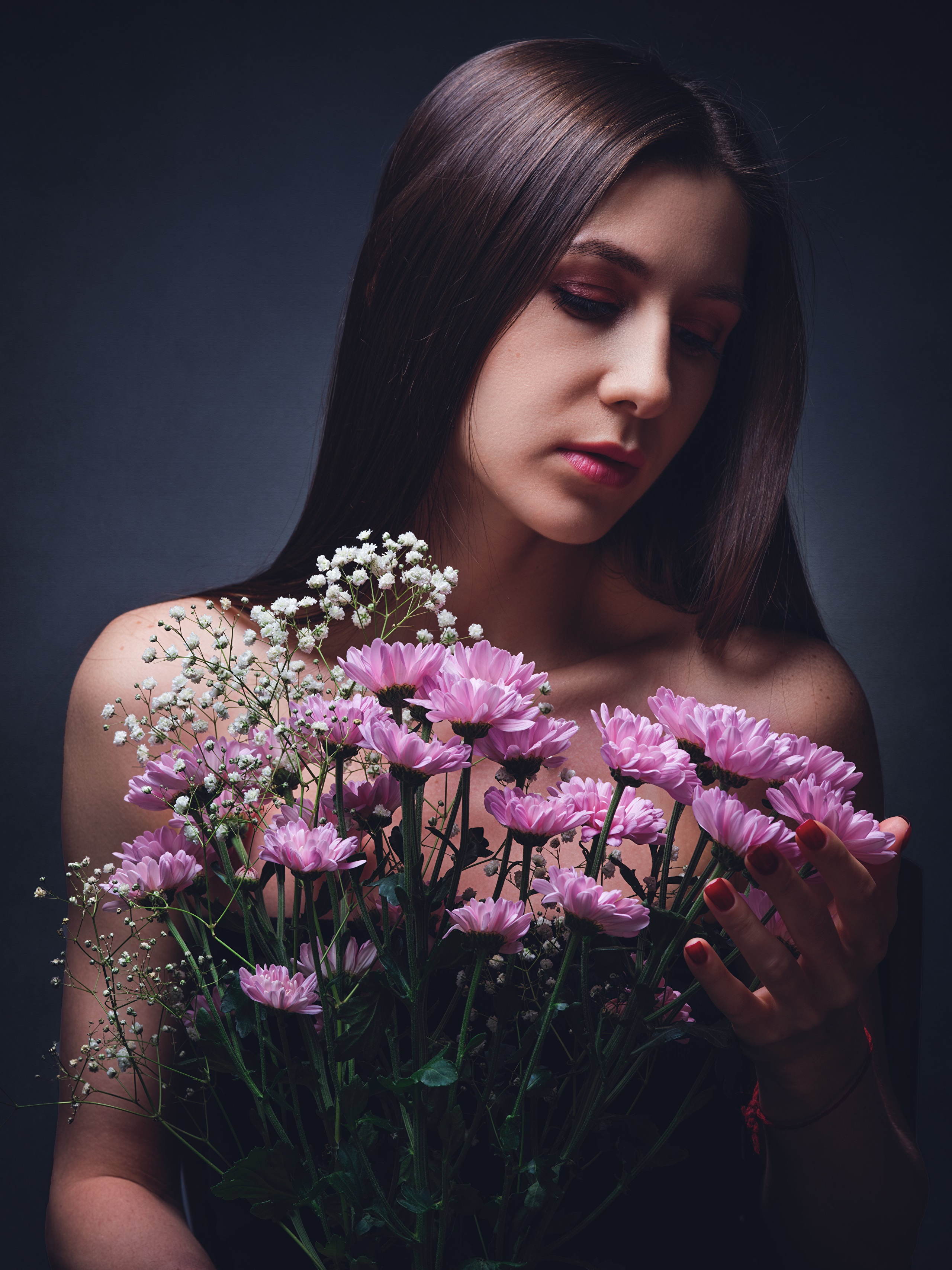 Woman with pink chrysanthemums HD Phone Wallpaper