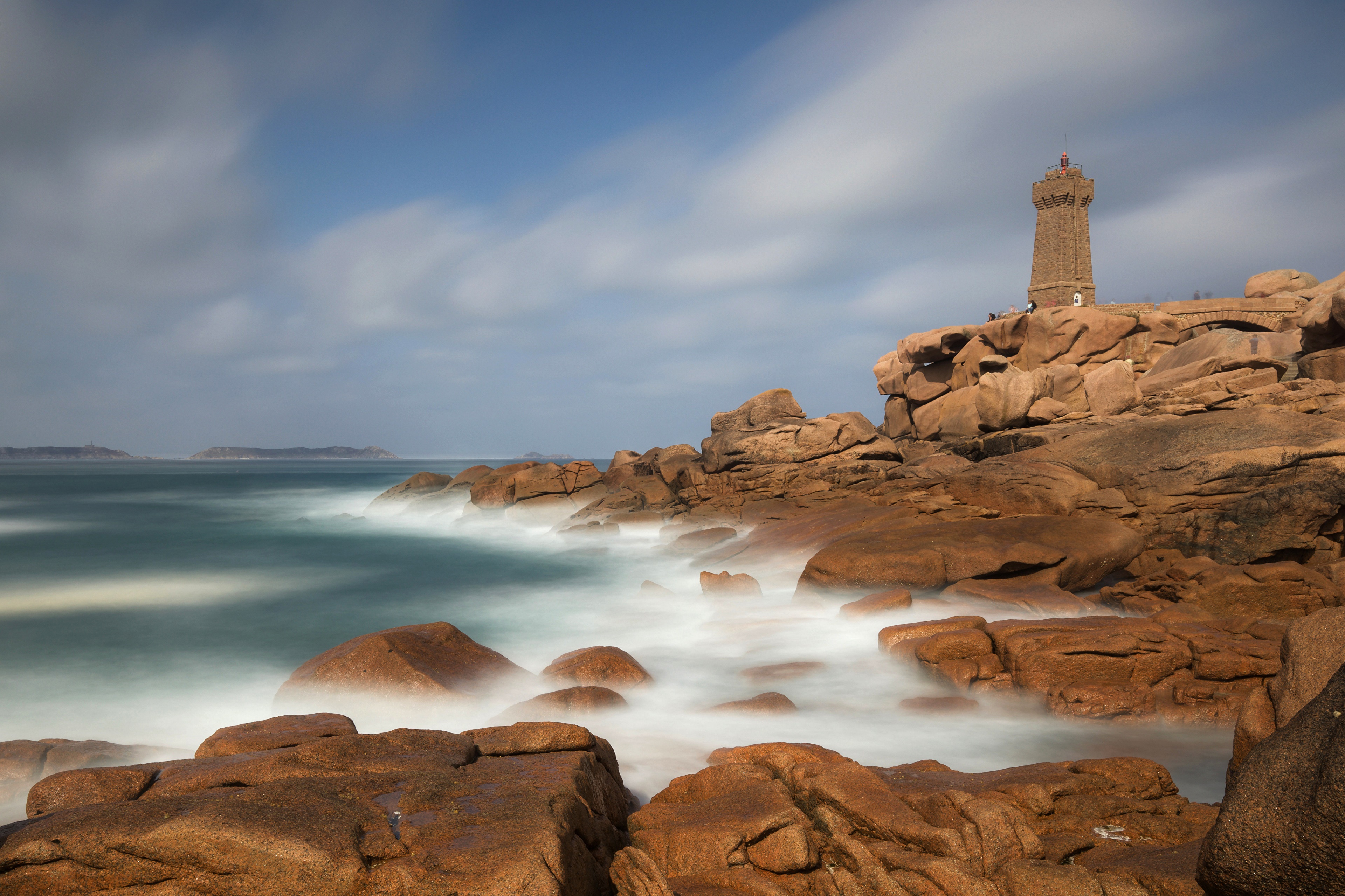 Lighthouse on rocky coast in Brittany, France HD Wallpaper