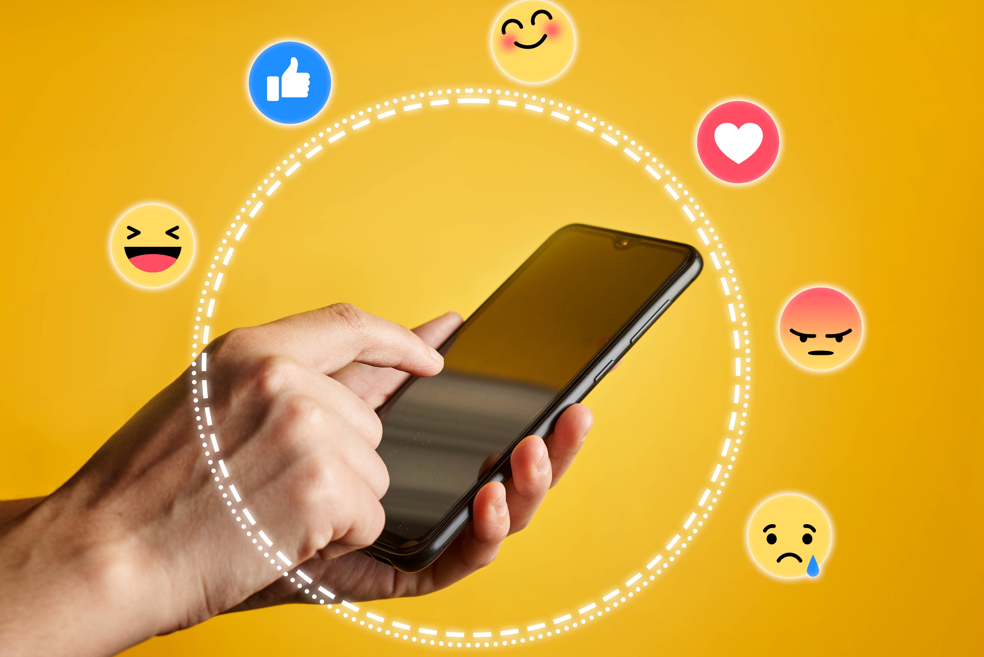 Smartphone with social media reactions on yellow background HD Wallpaper