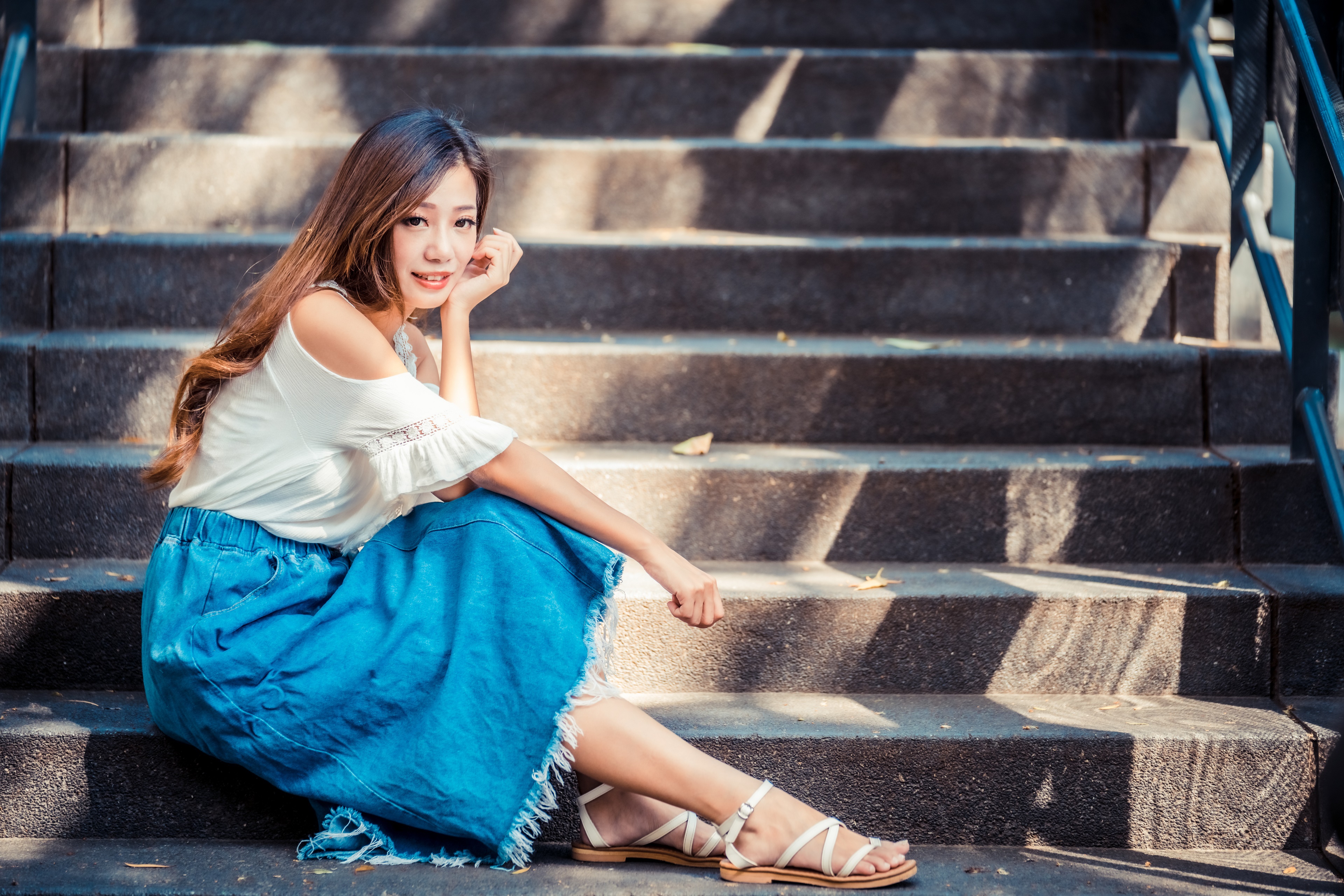 Asian woman with brown hair sitting on stairs HD Wallpaper