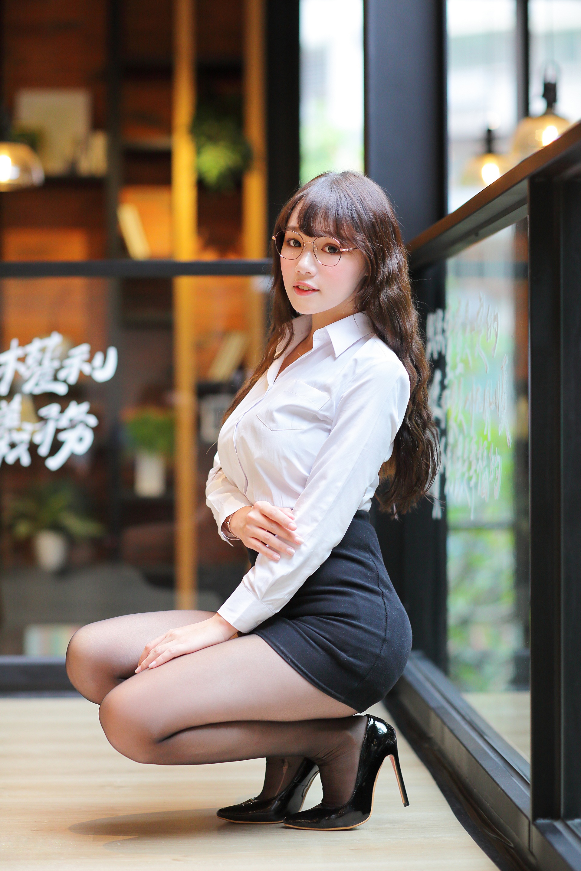 Asian woman in glasses, white blouse, and black skirt posing HD Phone Wallpaper