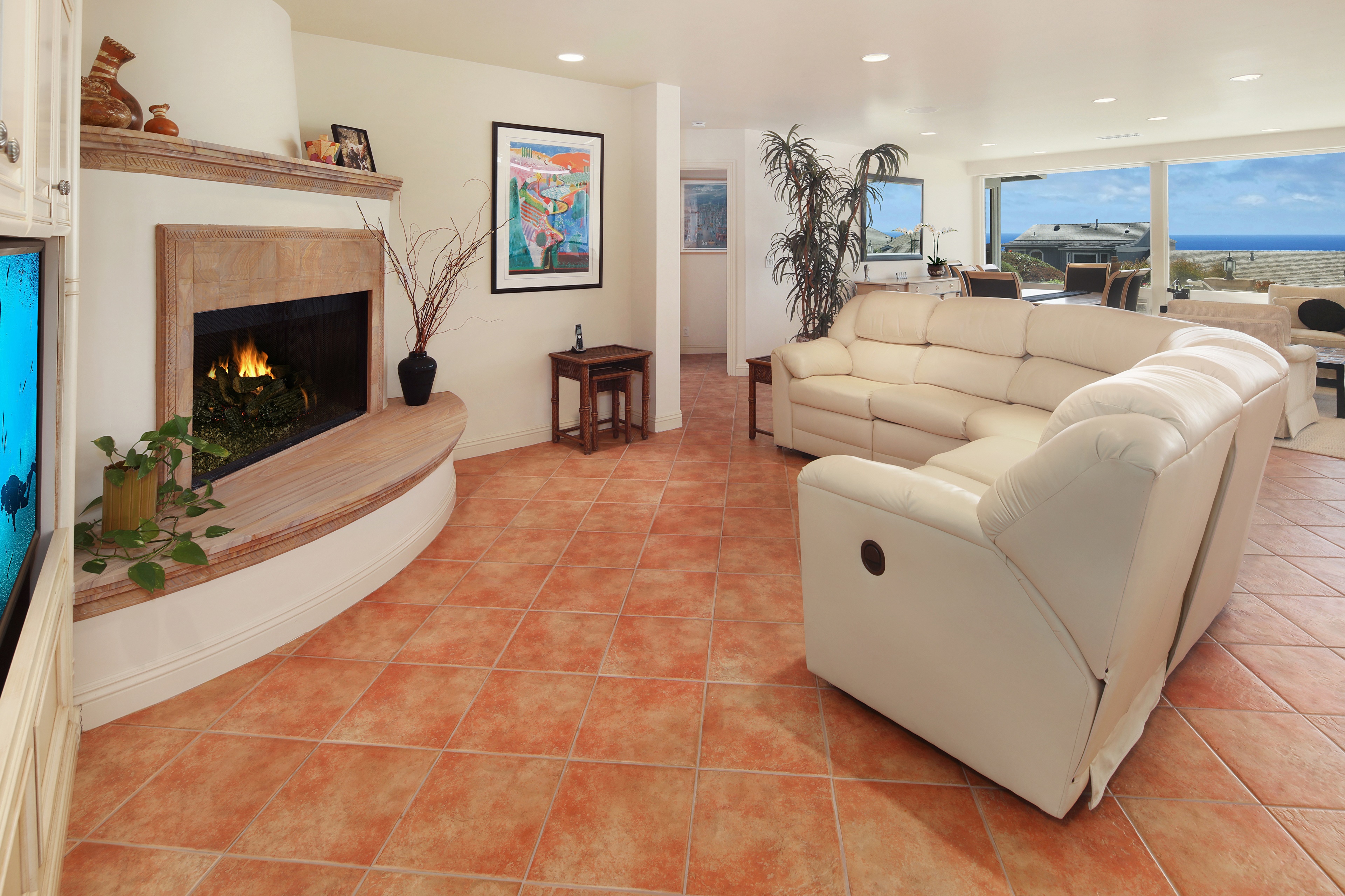 Living room with fireplace and ocean view HD Wallpaper