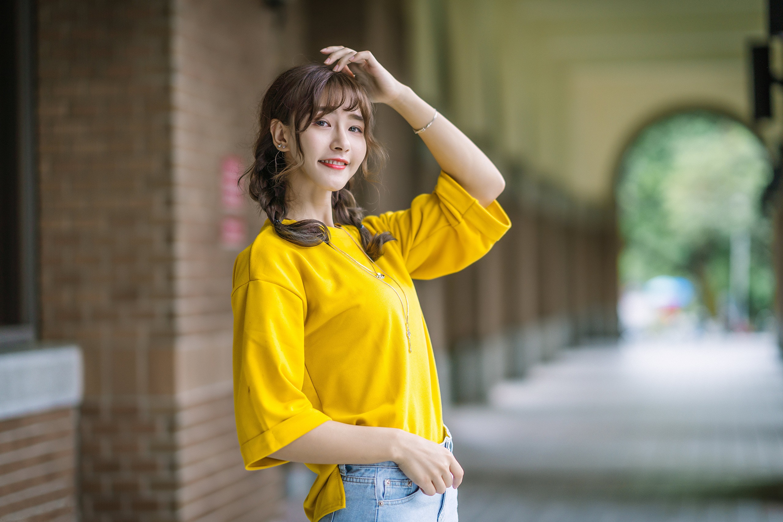 Asian woman with pigtails smiling HD Wallpaper