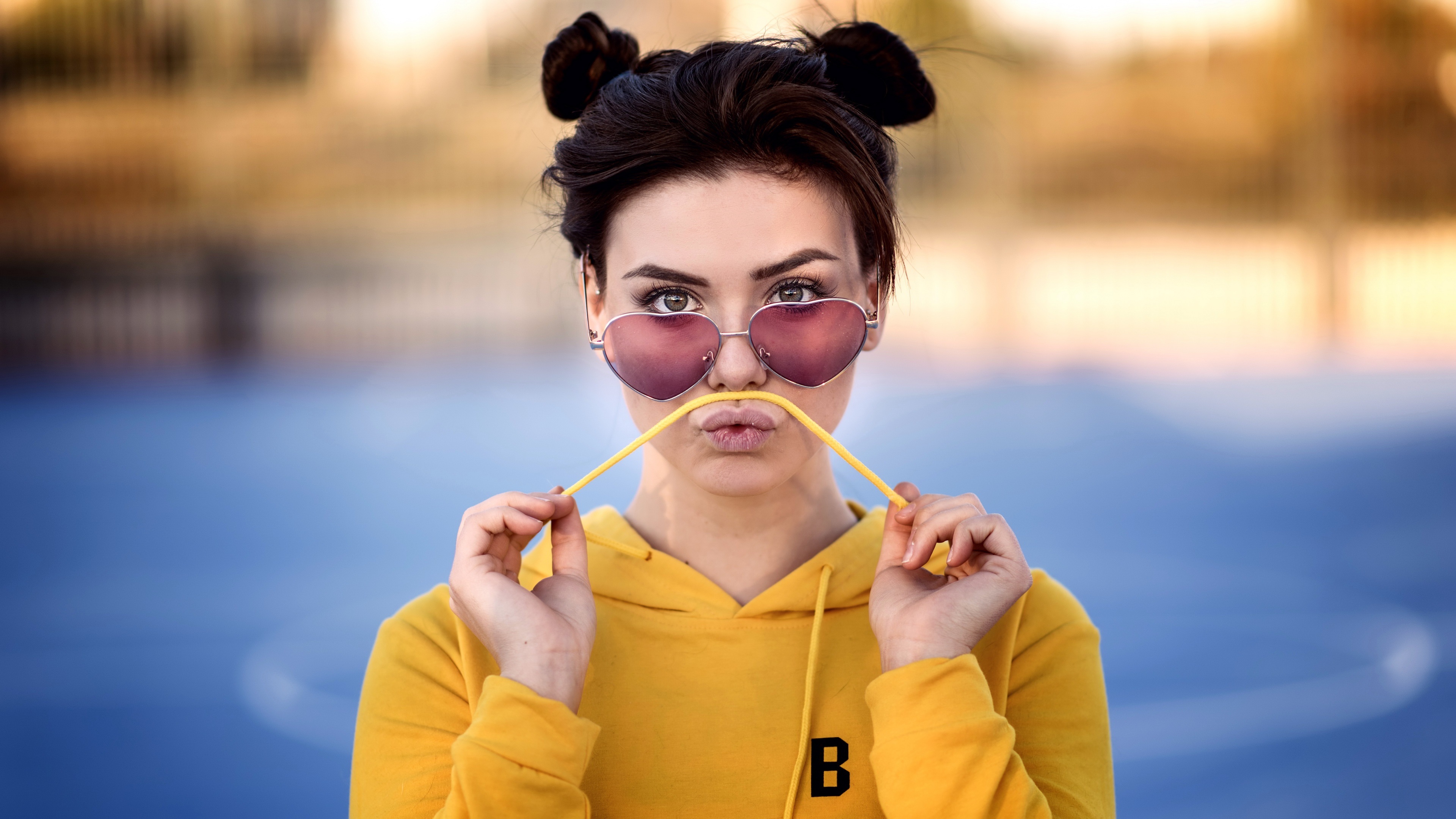 Paula with Heart-Shaped Glasses and Yellow Hoodie HD Wallpaper