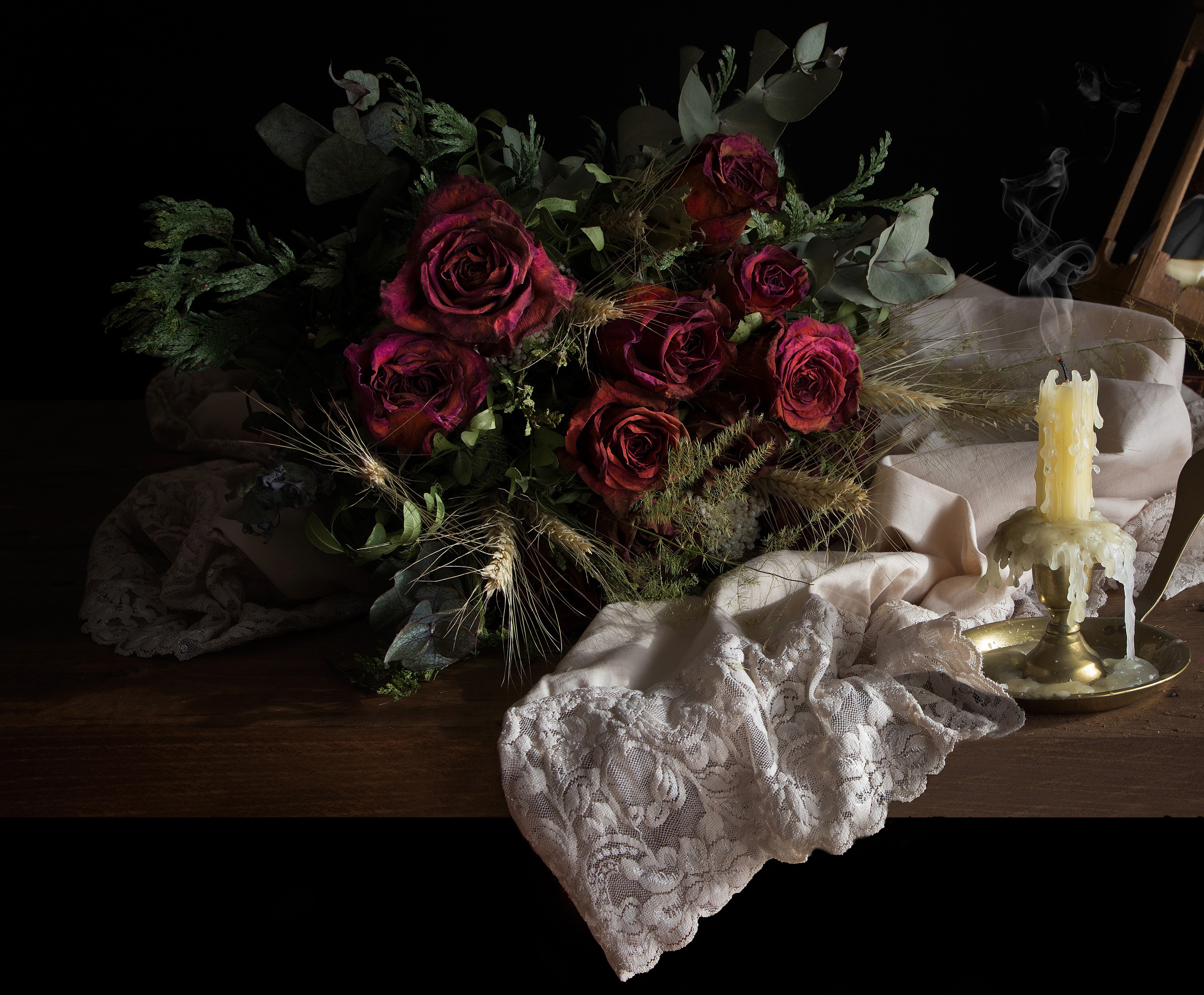 Still-life of dried roses and a lit candle HD Wallpaper