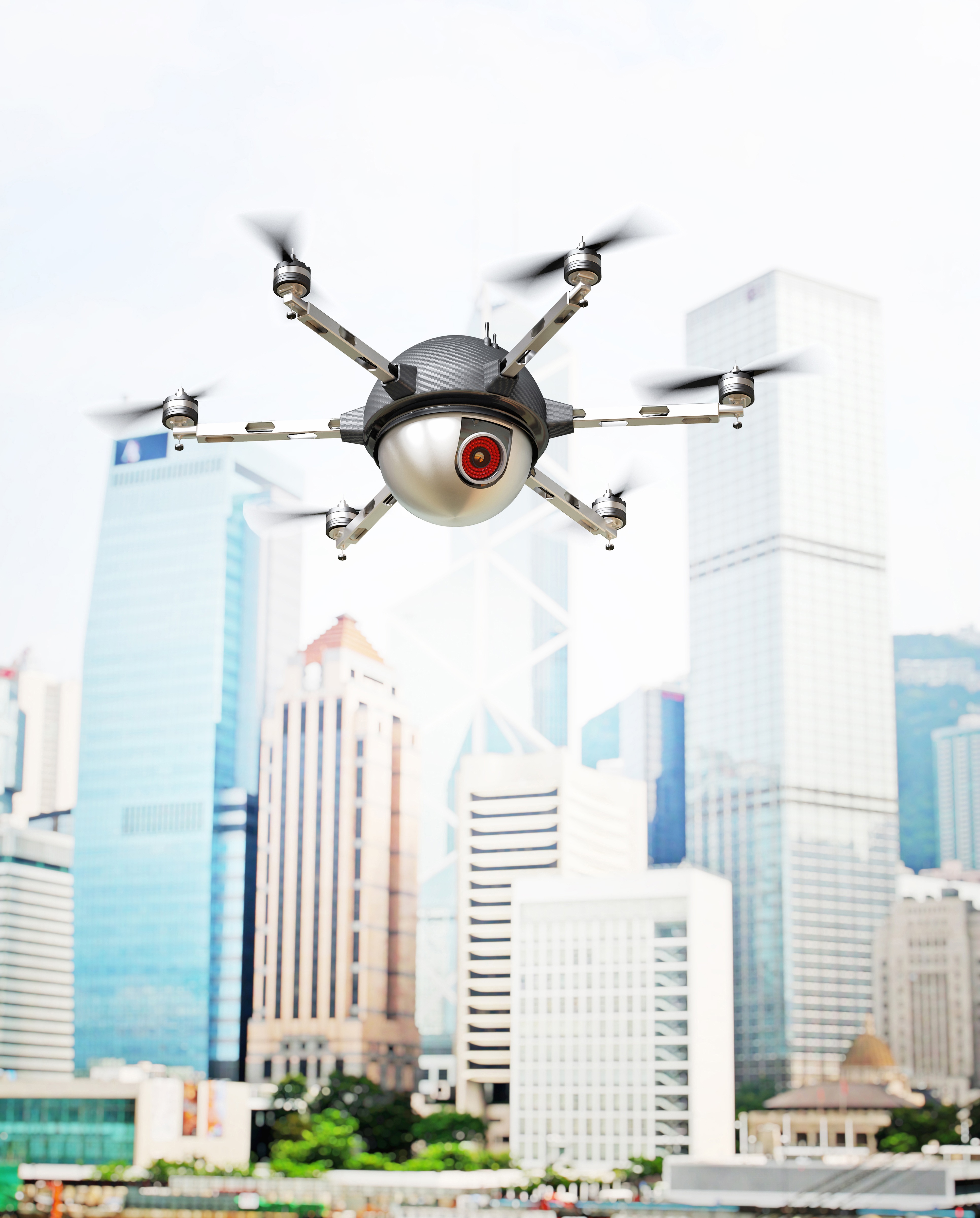 Drone with camera flying over city skyscrapers HD Phone Wallpaper