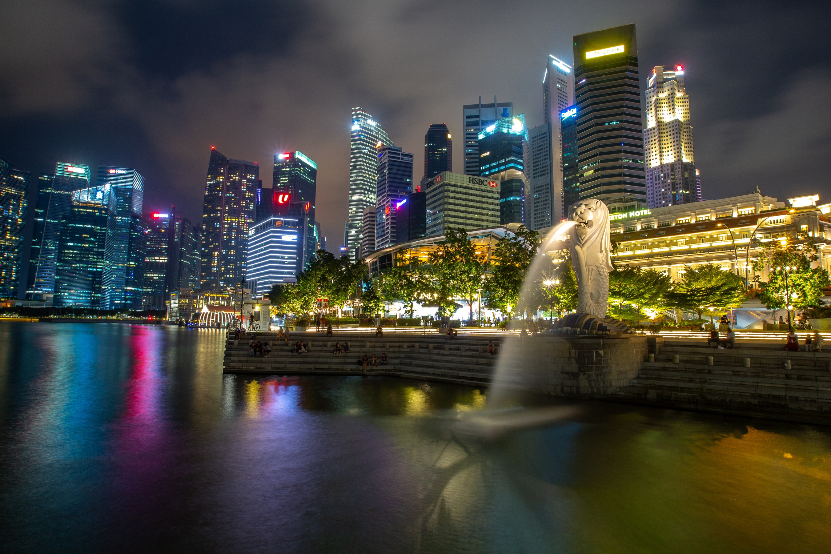 Singapore skyline with Merlion statue at night HD Wallpaper