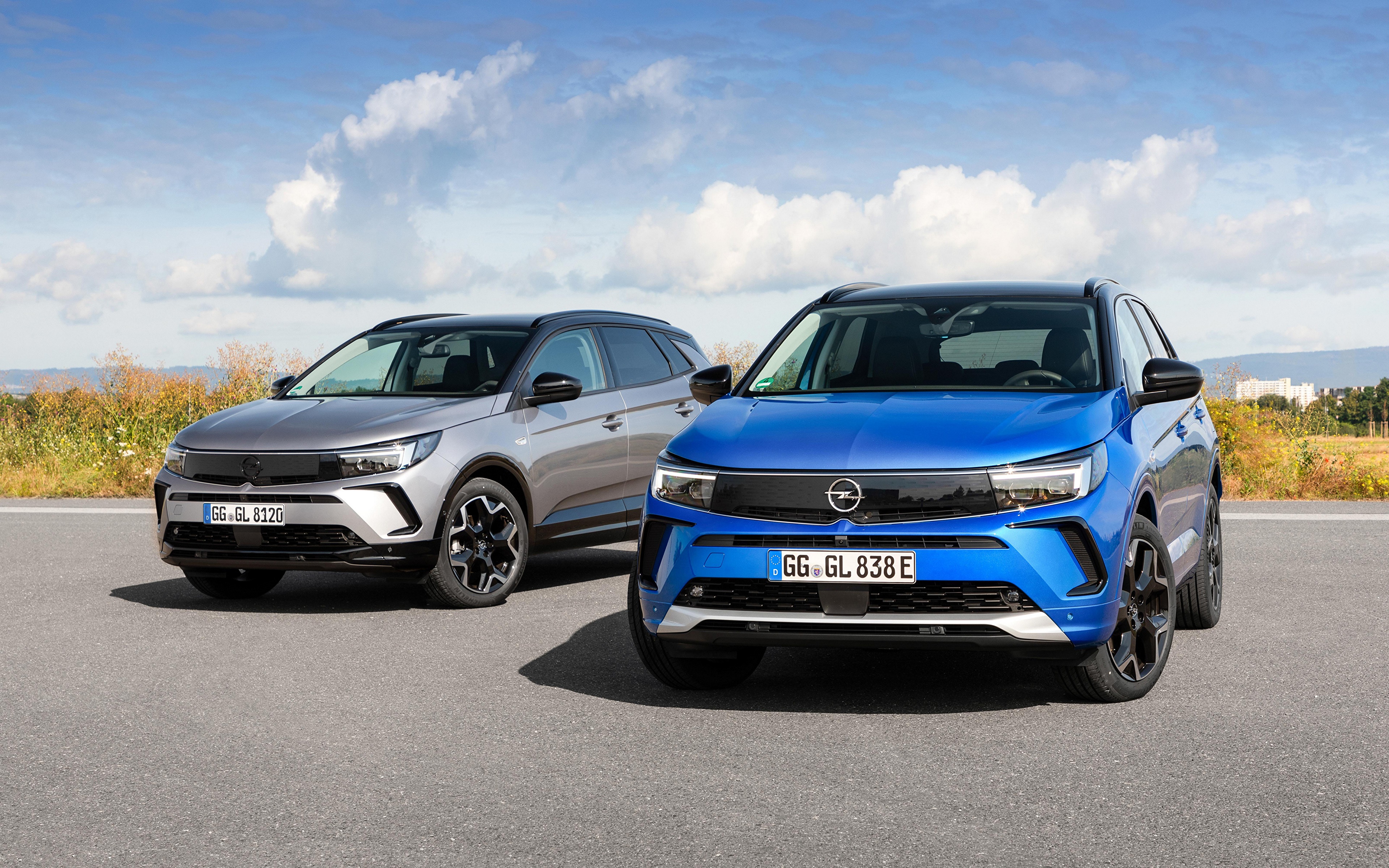 Two Opel Grandland SUVs, Blue and Grey HD Wallpaper