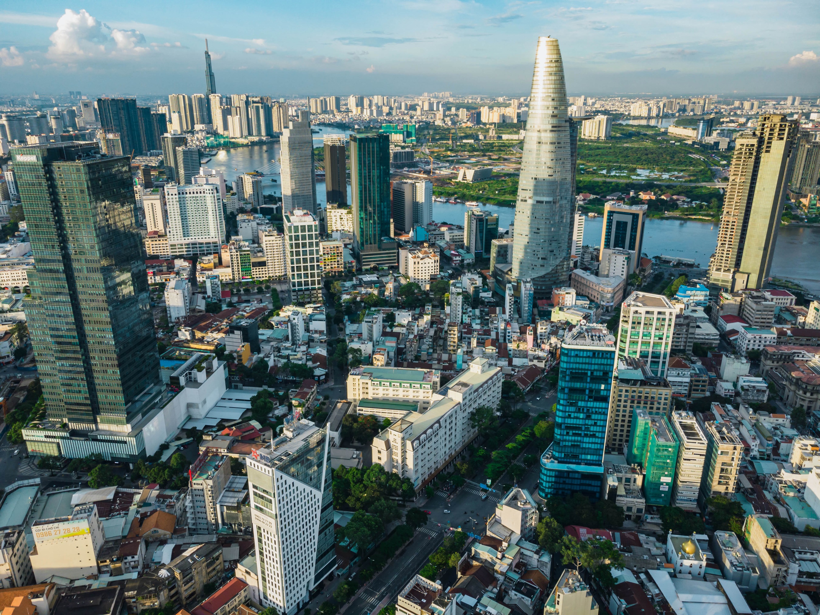 Ho Chi Minh City skyline with skyscrapers and river HD Wallpaper