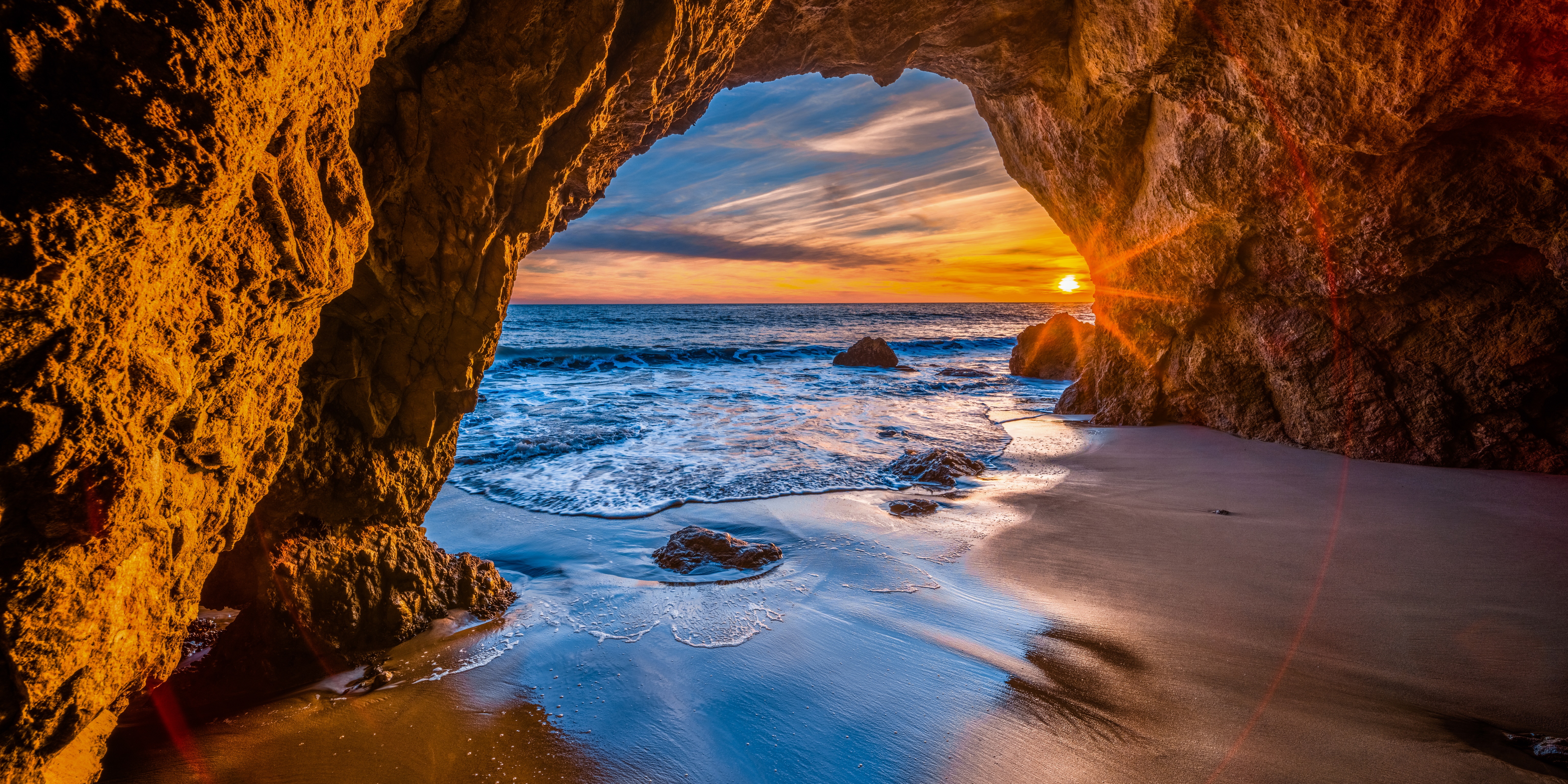 Sunset viewed from a cave on the California coast HD Wallpaper