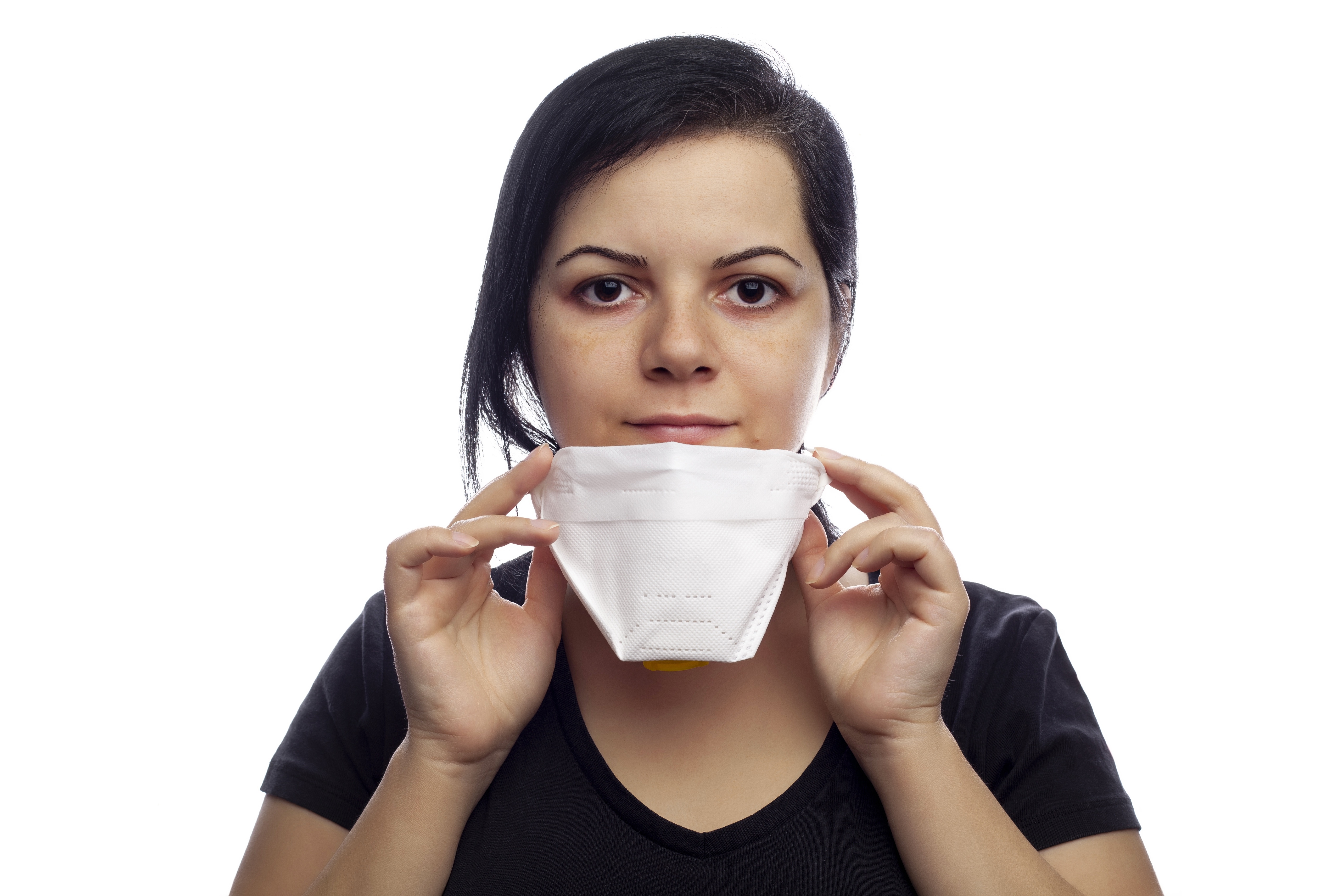 Brunette girl holding a white face mask HD Wallpaper