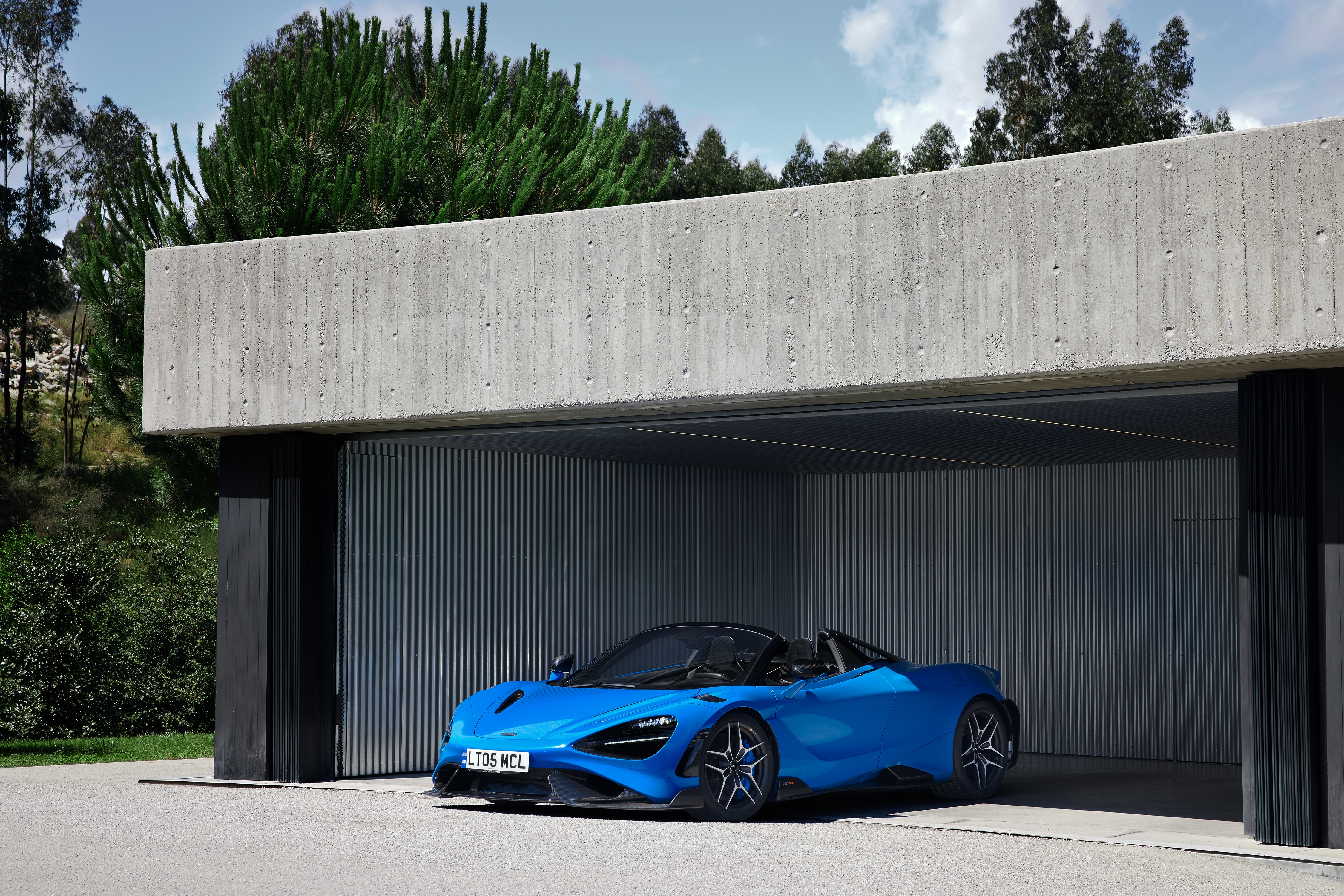 Blue McLaren 765LT Spider in a Modern Garage HD Wallpaper