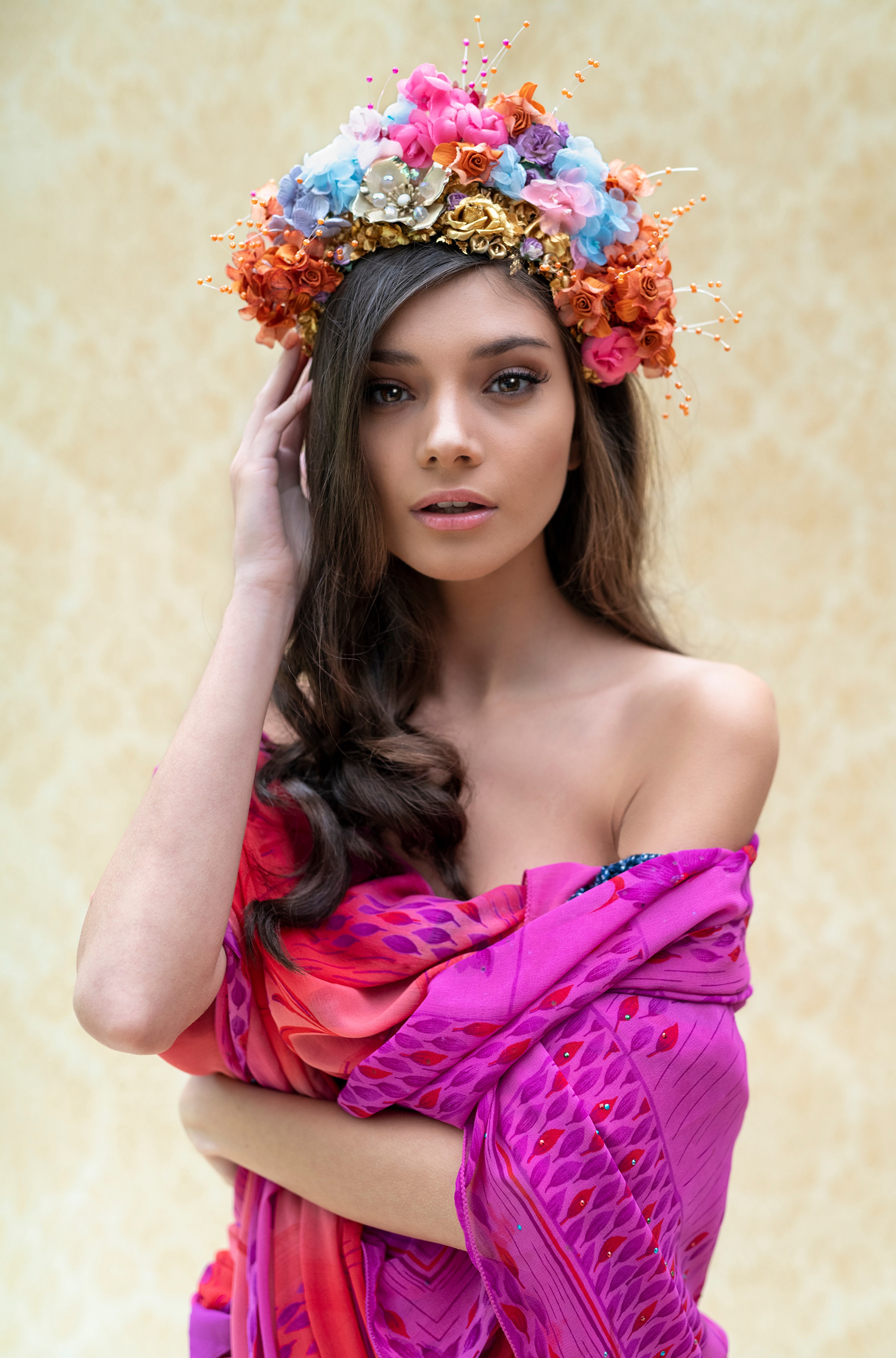 Model wearing a floral wreath and colorful scarf HD Phone Wallpaper