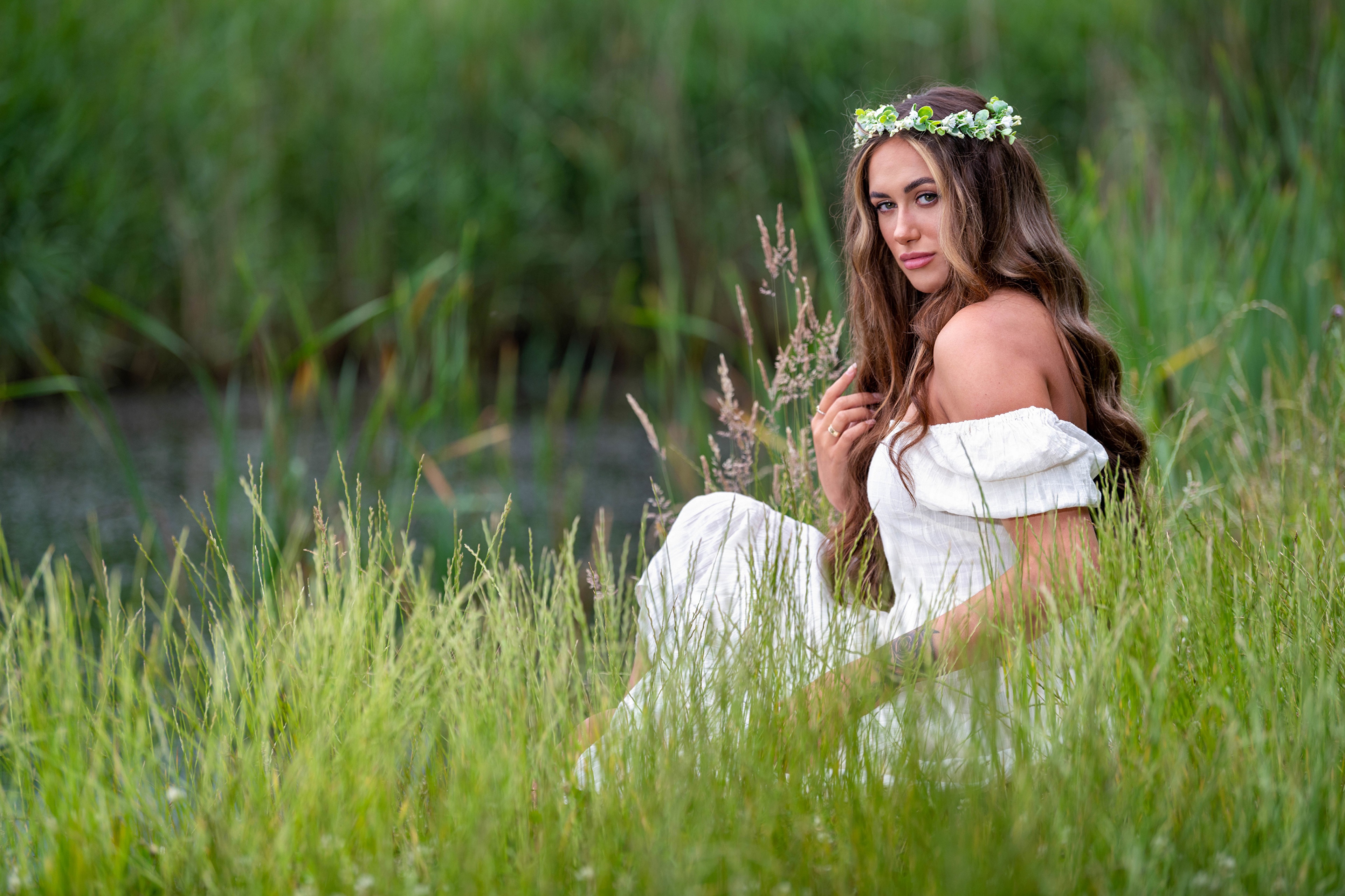 Woman with Flower Wreath Sitting in Grass HD Wallpaper