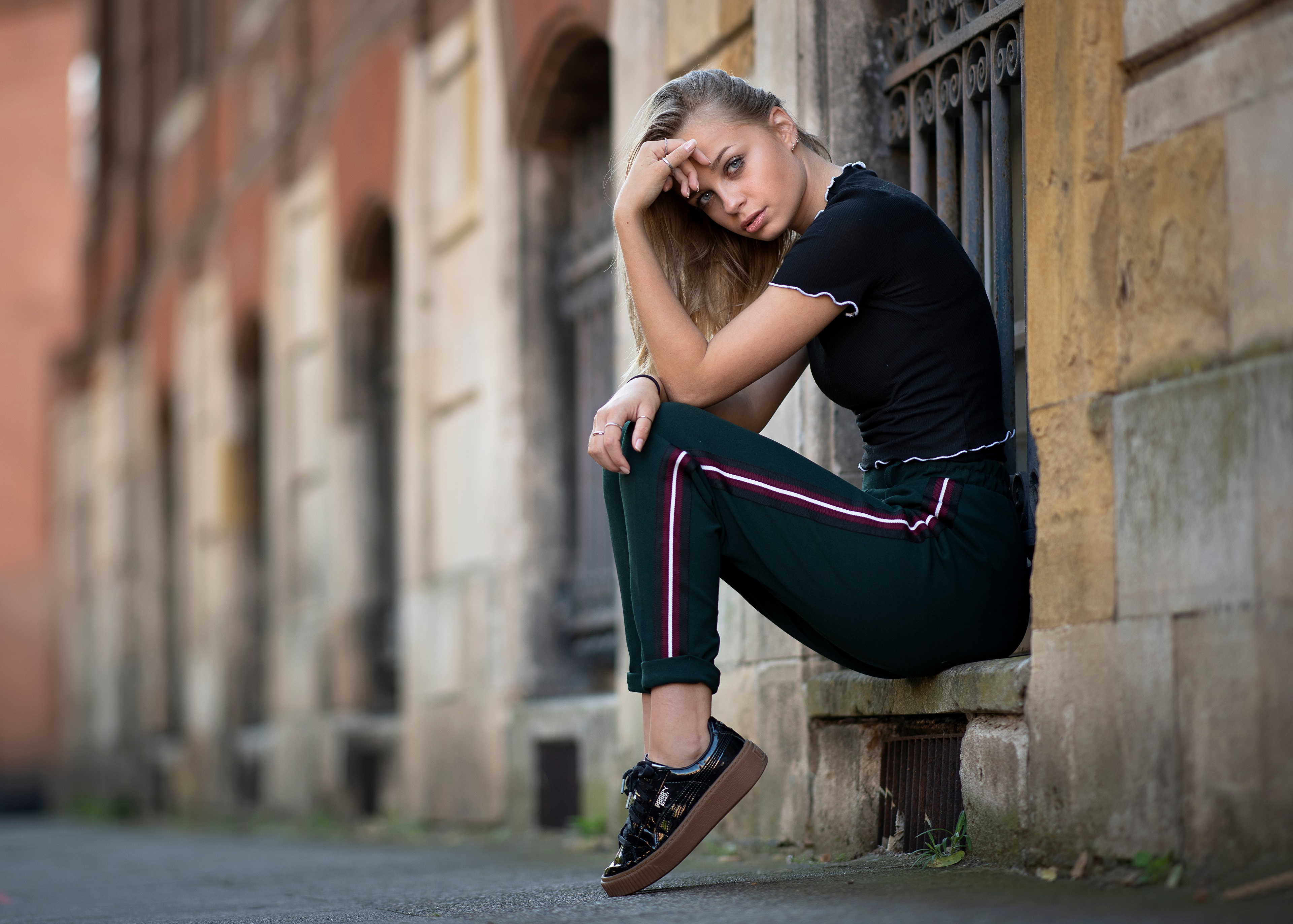 Loriane sitting on a ledge HD Wallpaper