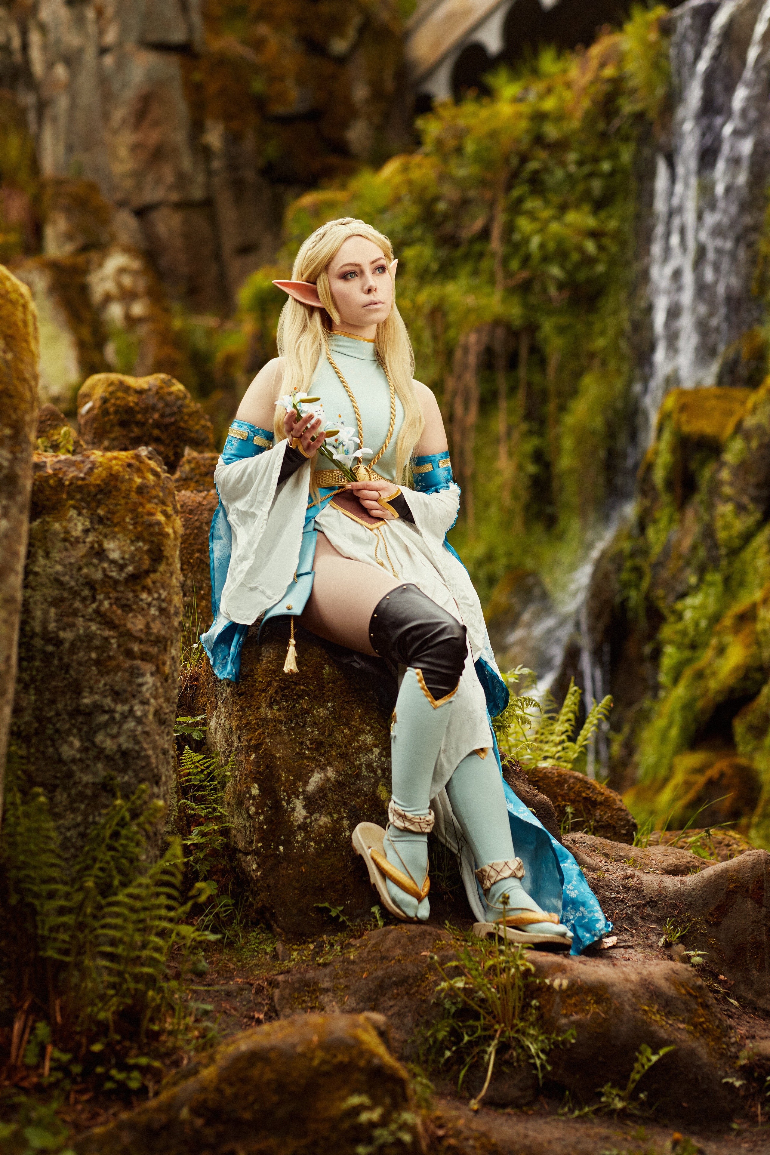 Zelda from The Legend of Zelda sitting by a waterfall HD Phone Wallpaper
