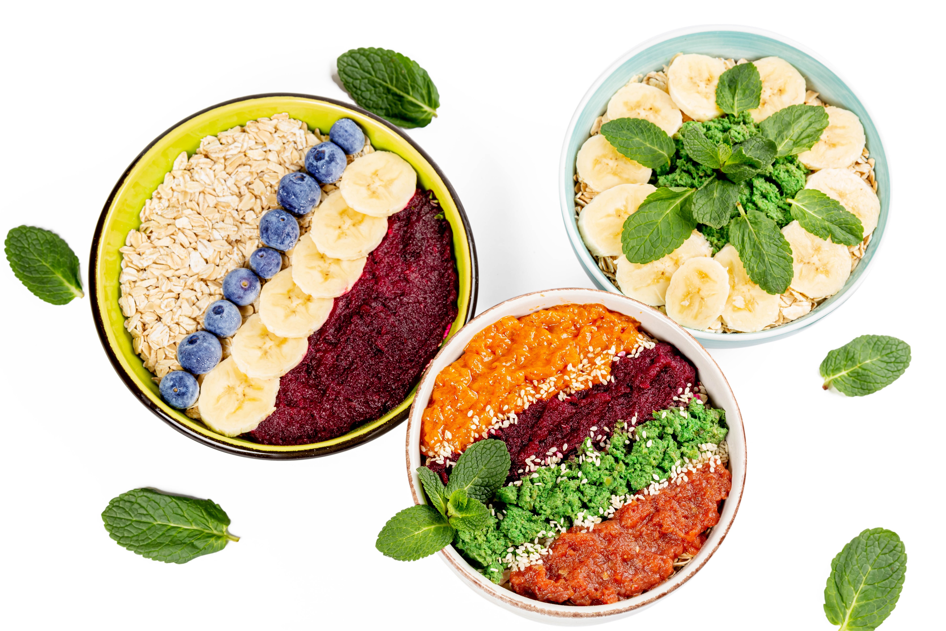 Three bowls of oatmeal with fruit and vegetables HD Wallpaper