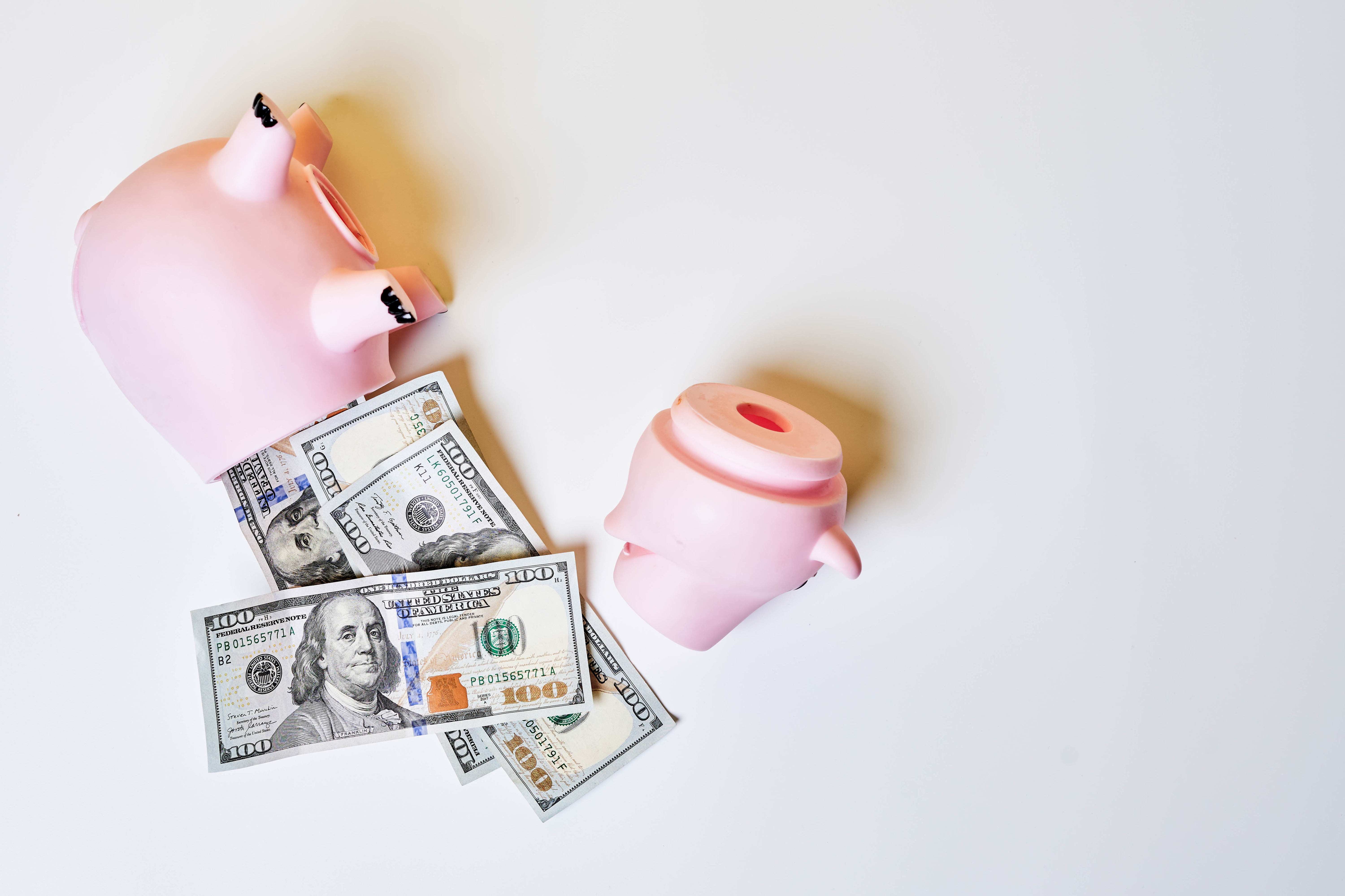 Broken Piggy Bank with US Dollar Bills HD Wallpaper