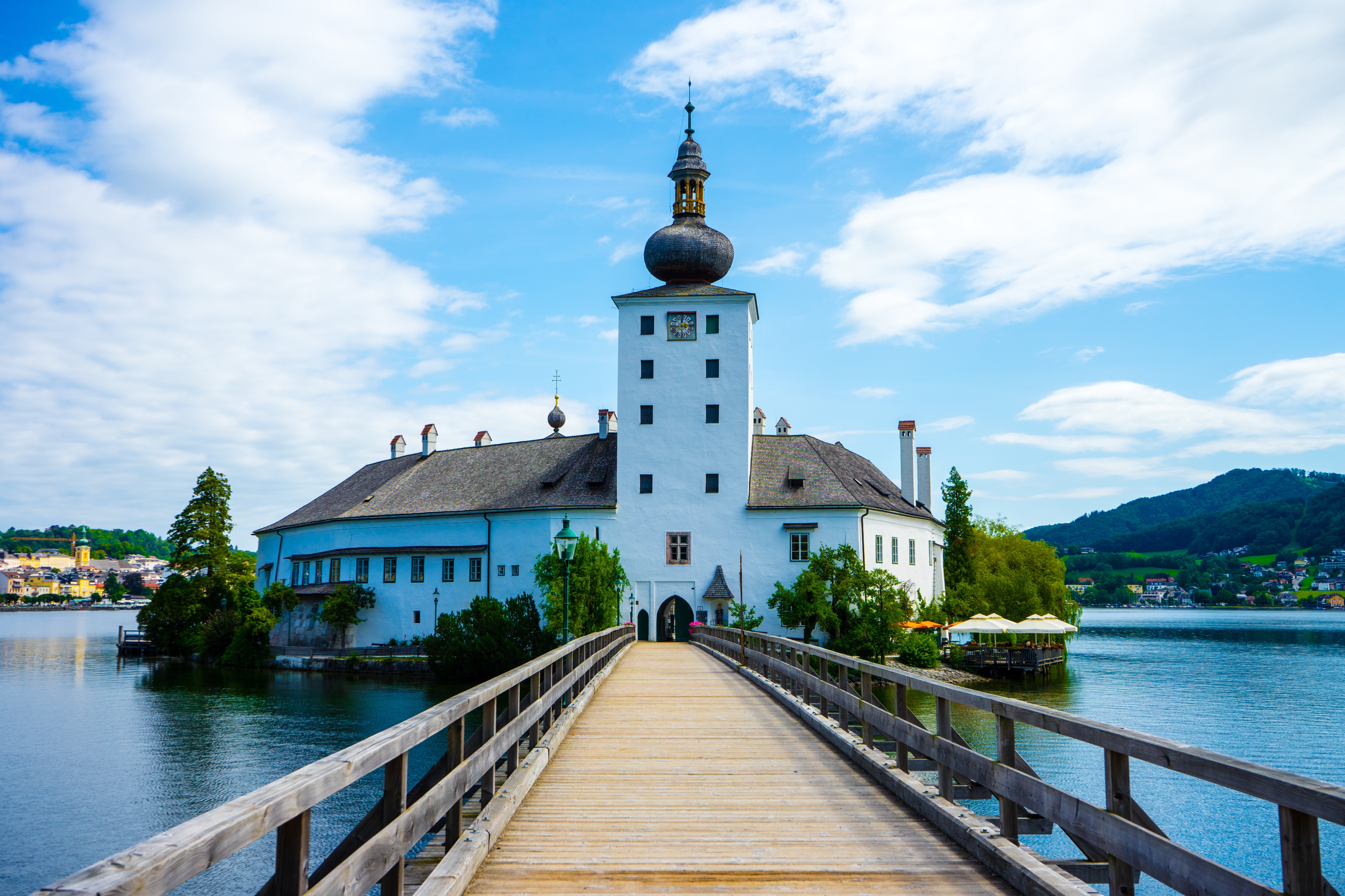 Schlosshotel Velden, Austria, with bridge and lake HD Wallpaper