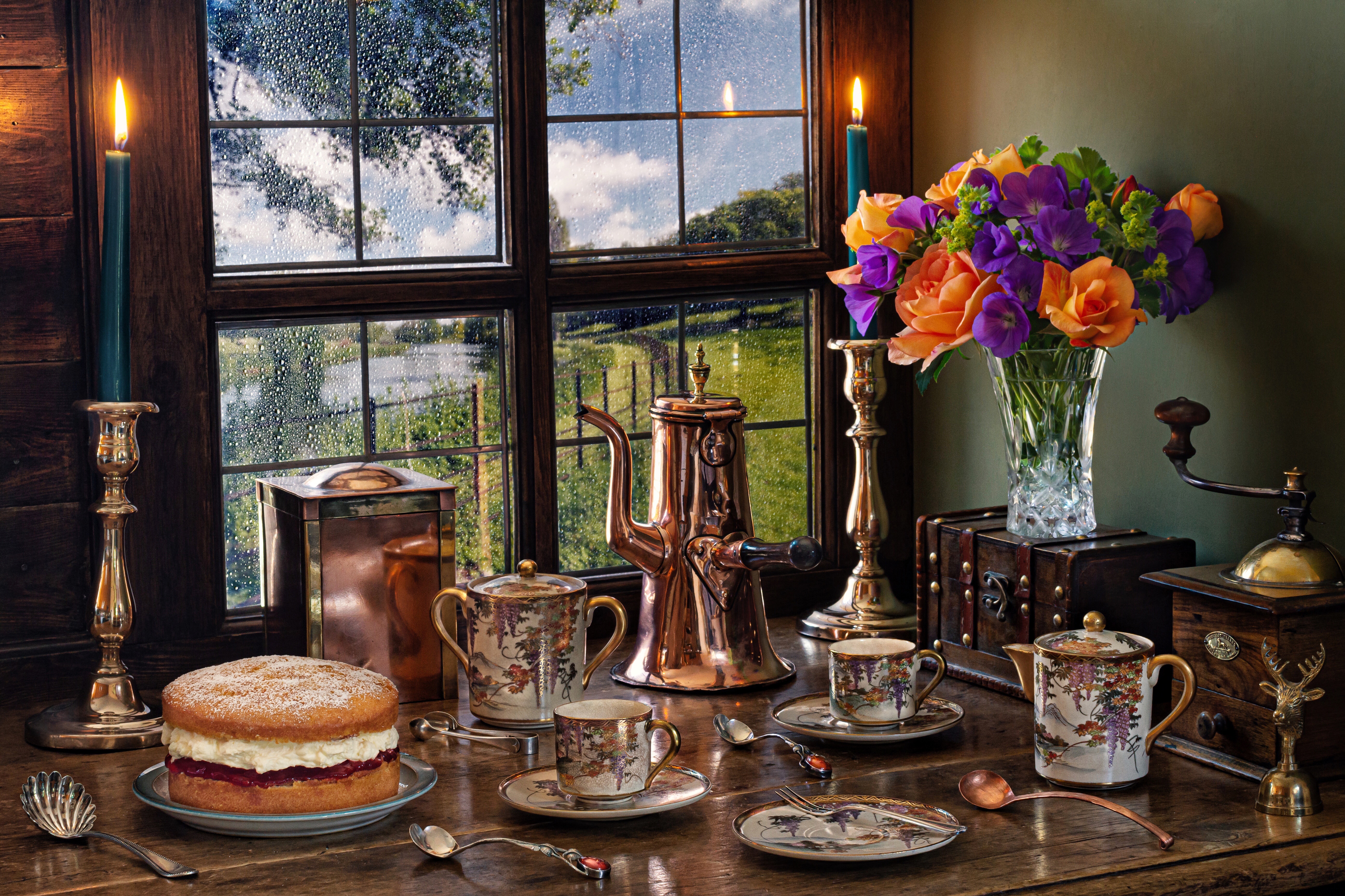 Still-life with cake, tea set, and flowers by a window HD Wallpaper