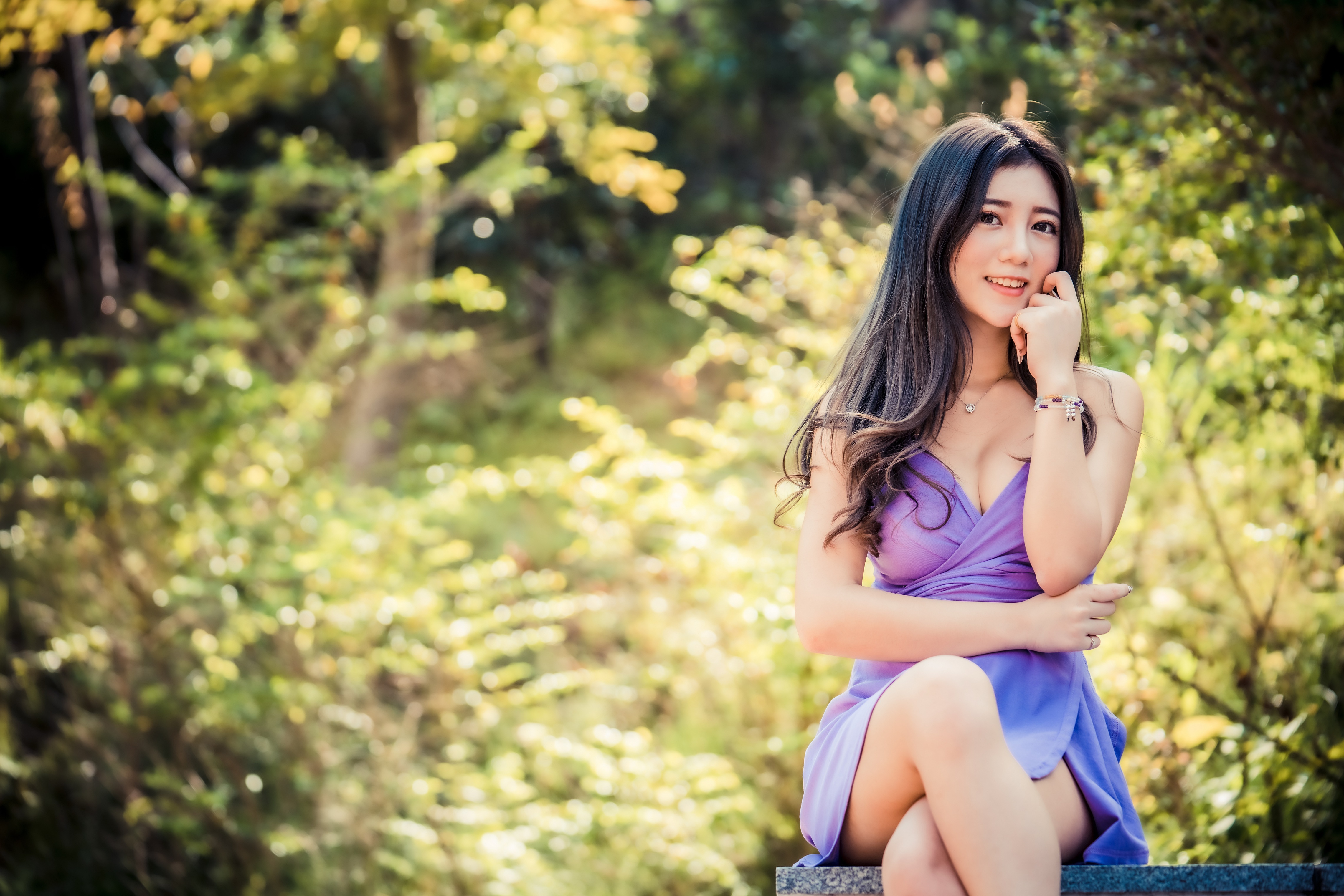Asian woman in purple dress sitting outdoors HD Wallpaper