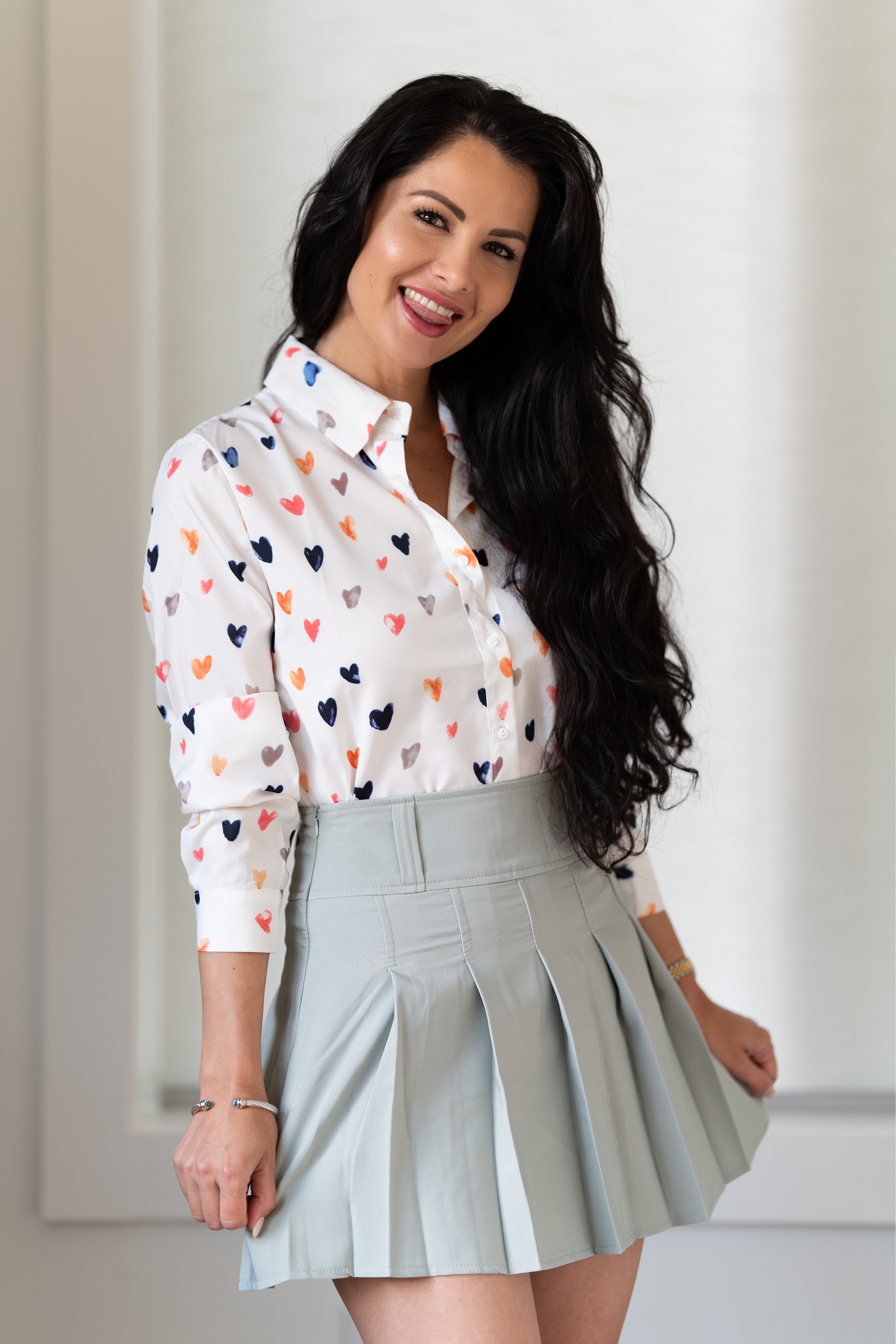 Victoria Bell in a heart print blouse and skirt HD Phone Wallpaper