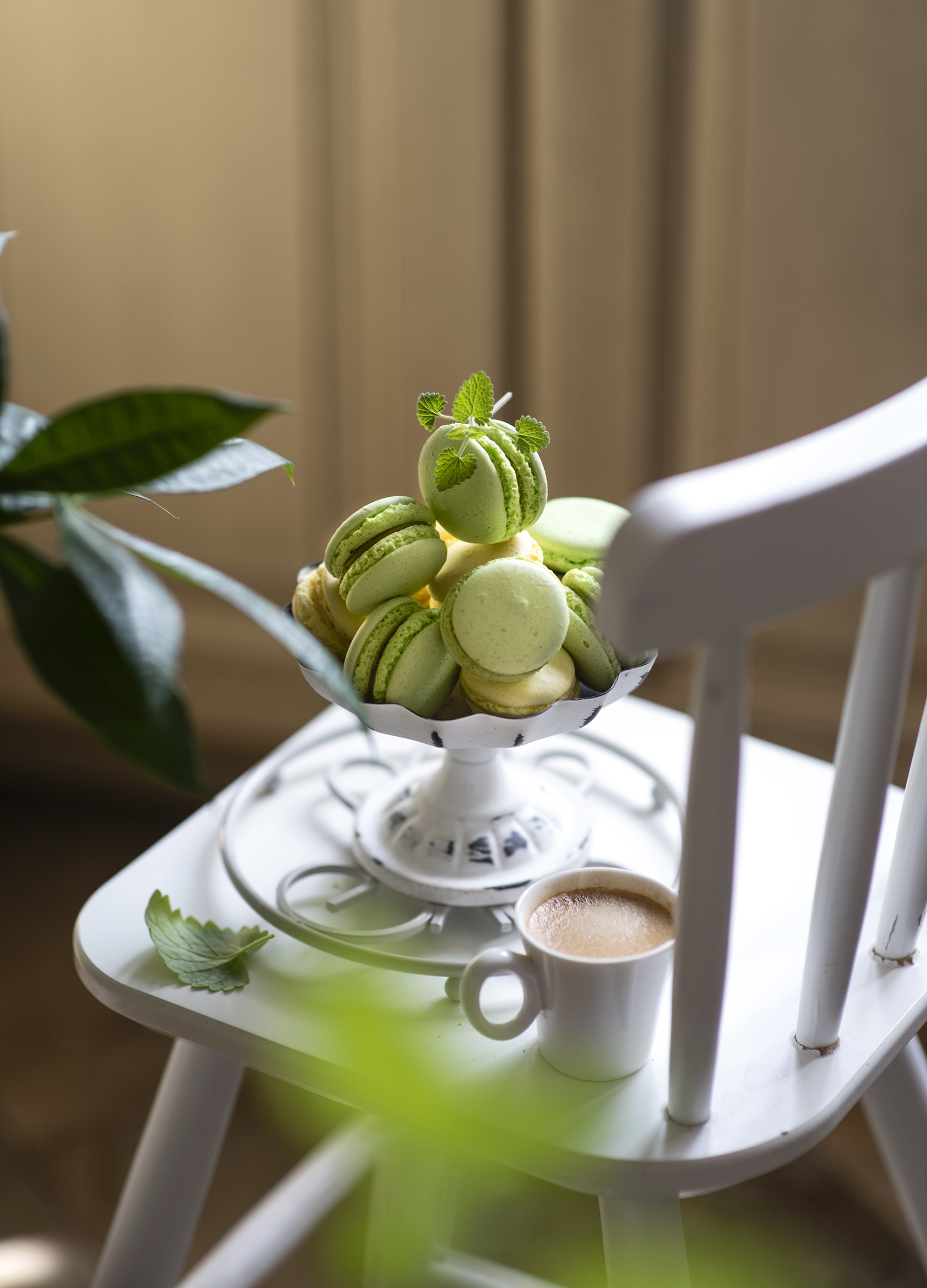 Green macarons and coffee on a white chair HD Phone Wallpaper