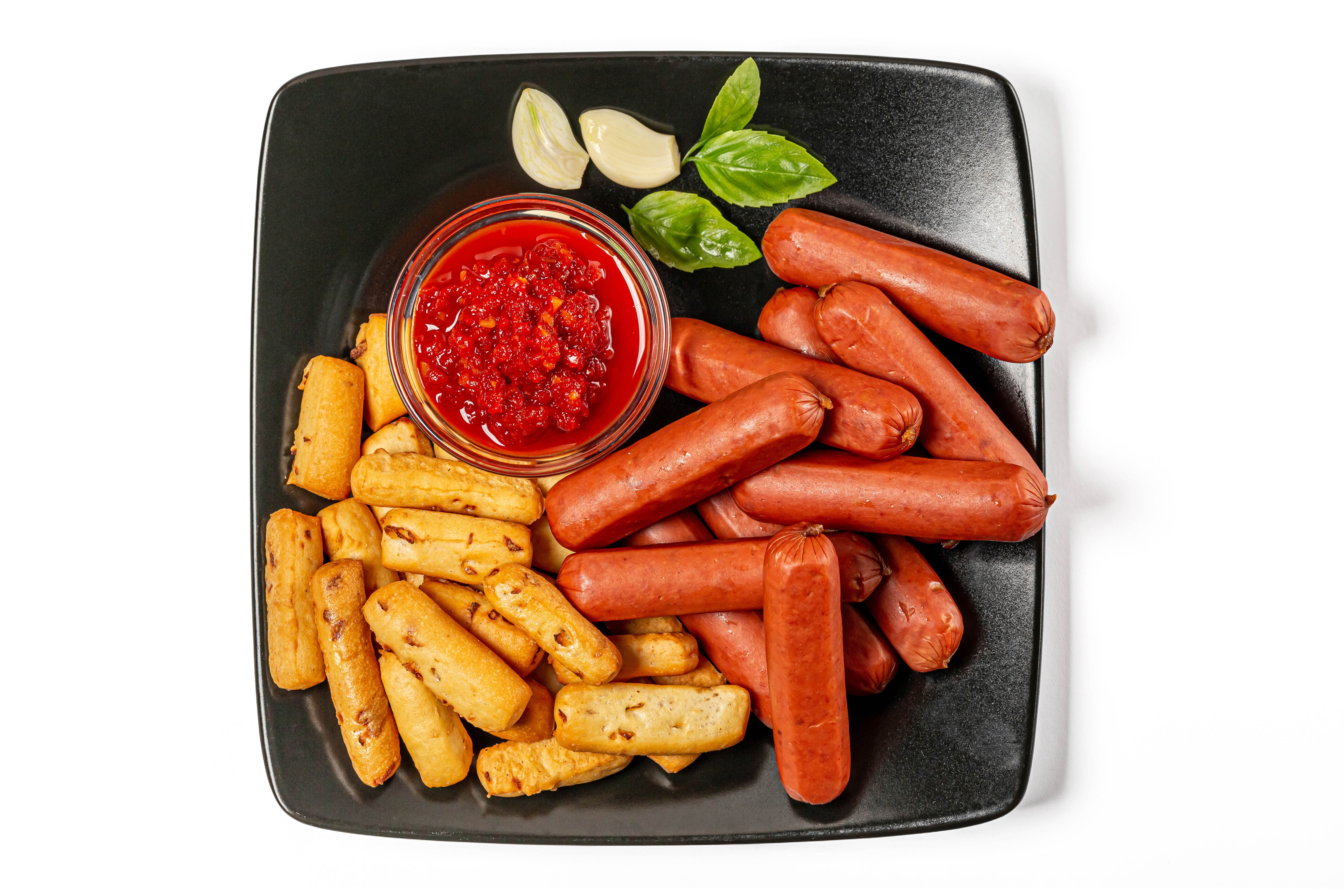 Vienna sausages with breadsticks and chili sauce HD Wallpaper