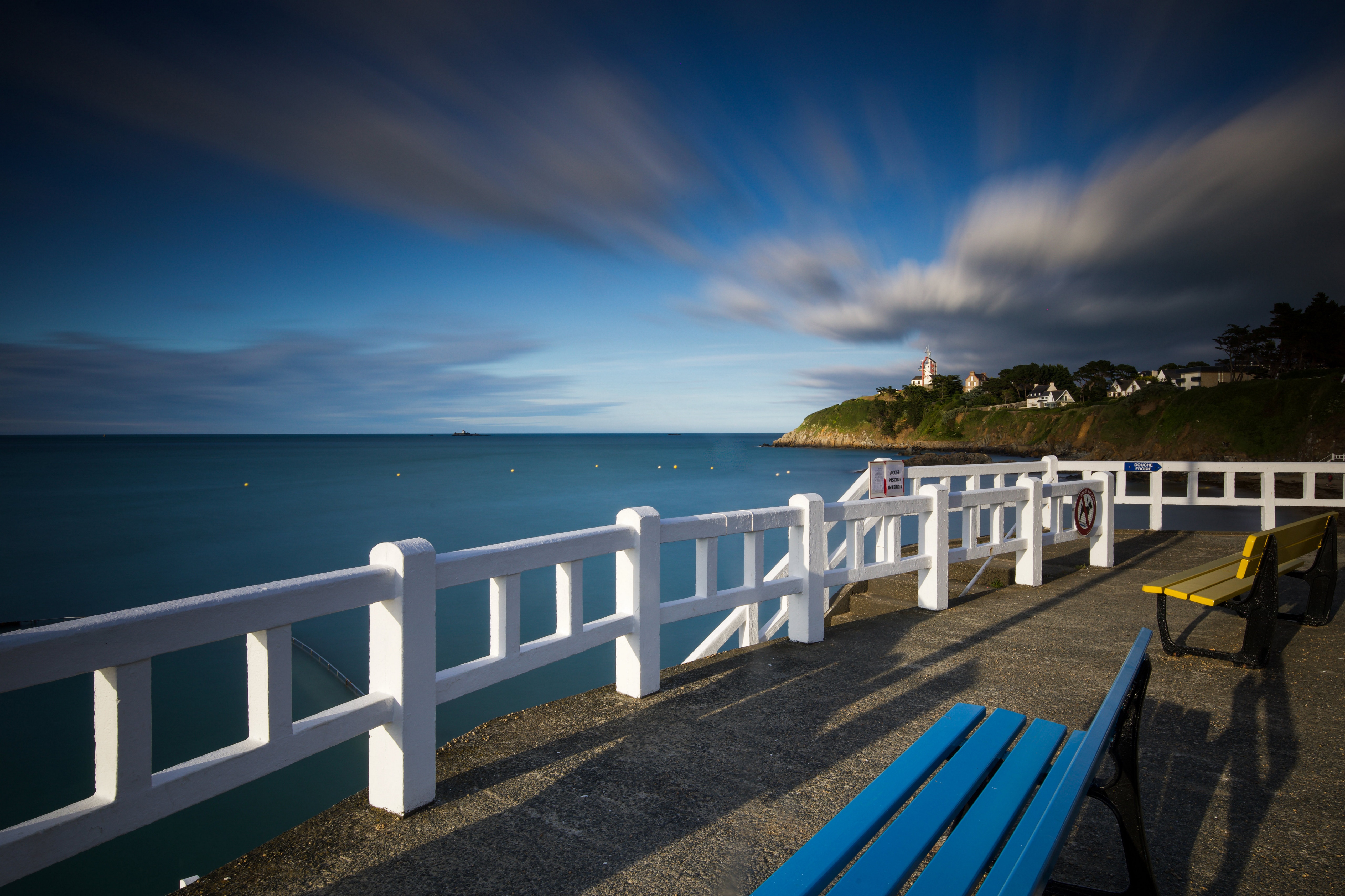 Bretagne, France Waterfront with Clouds and Benches HD Wallpaper