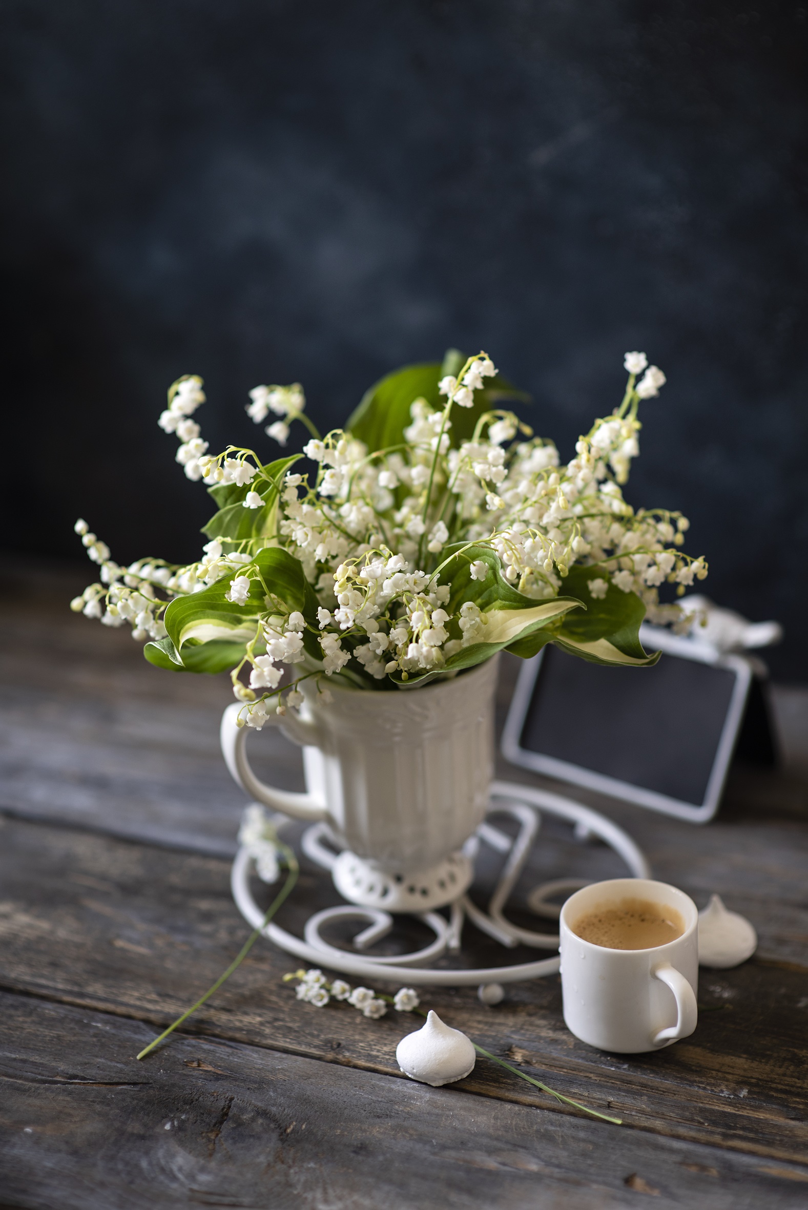 Lily of the valley flowers in a vase with coffee HD Phone Wallpaper