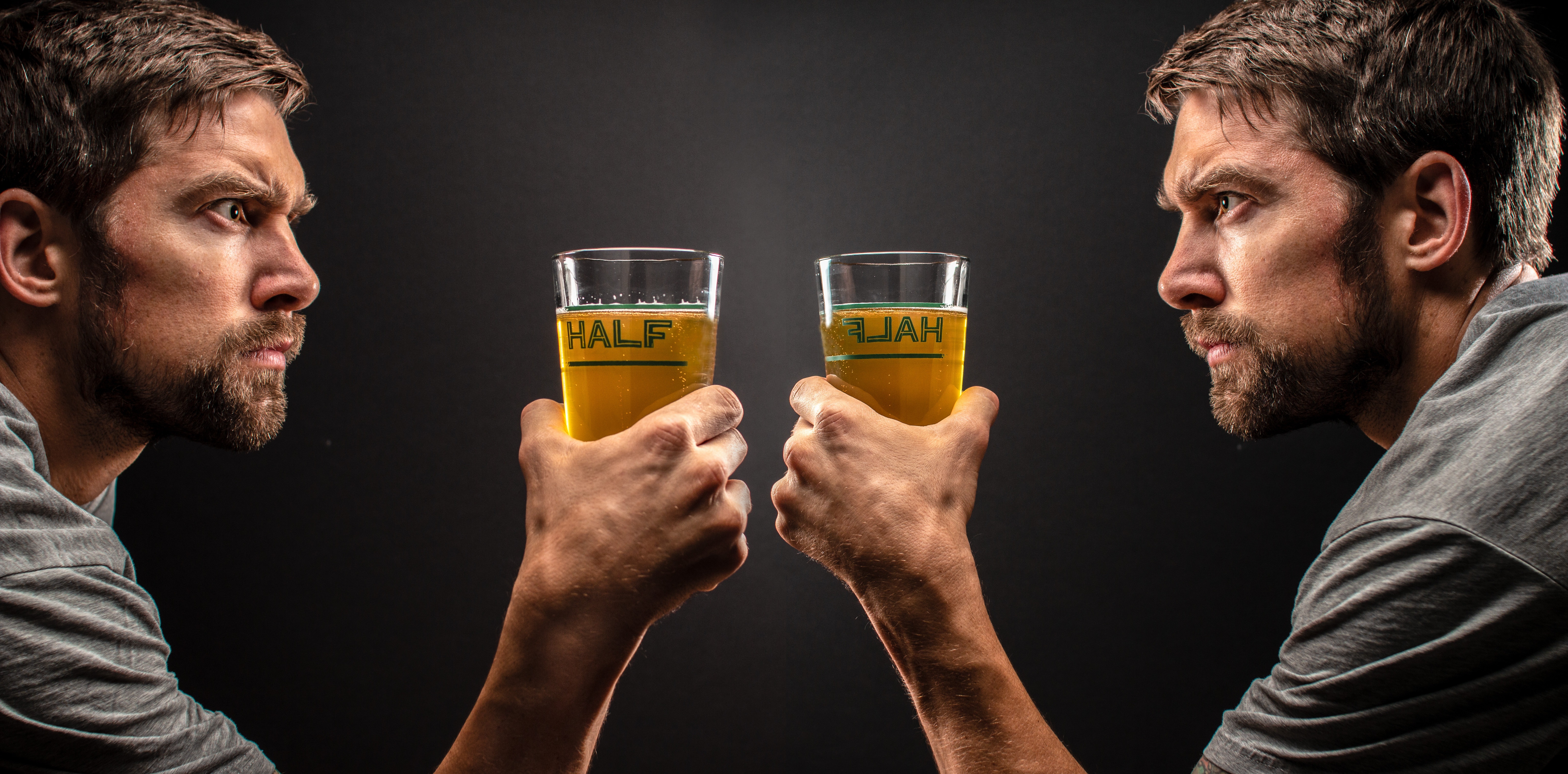 Men holding beer glasses with 'HALF' written on them HD Wallpaper