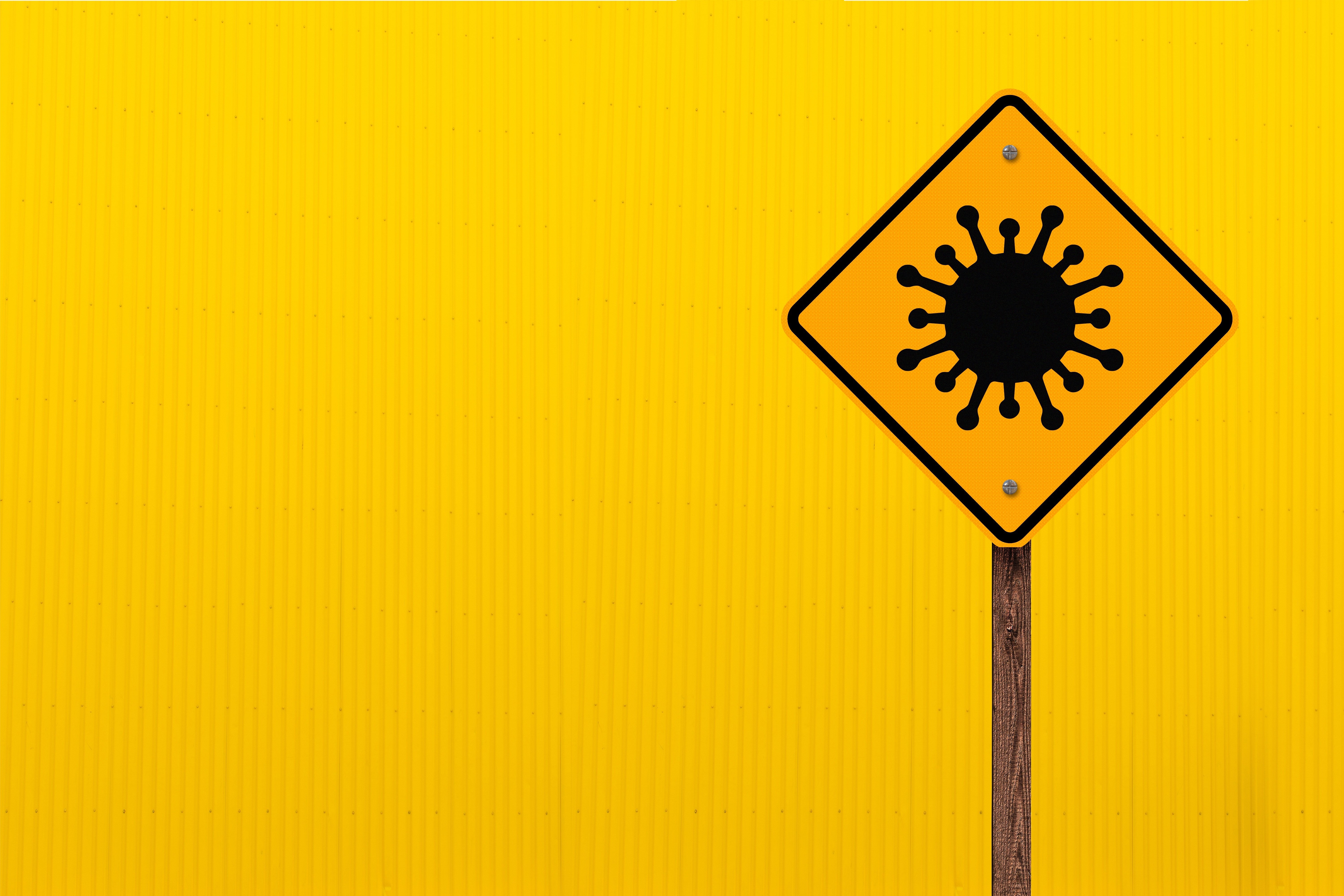 Coronavirus warning sign on yellow background HD Wallpaper