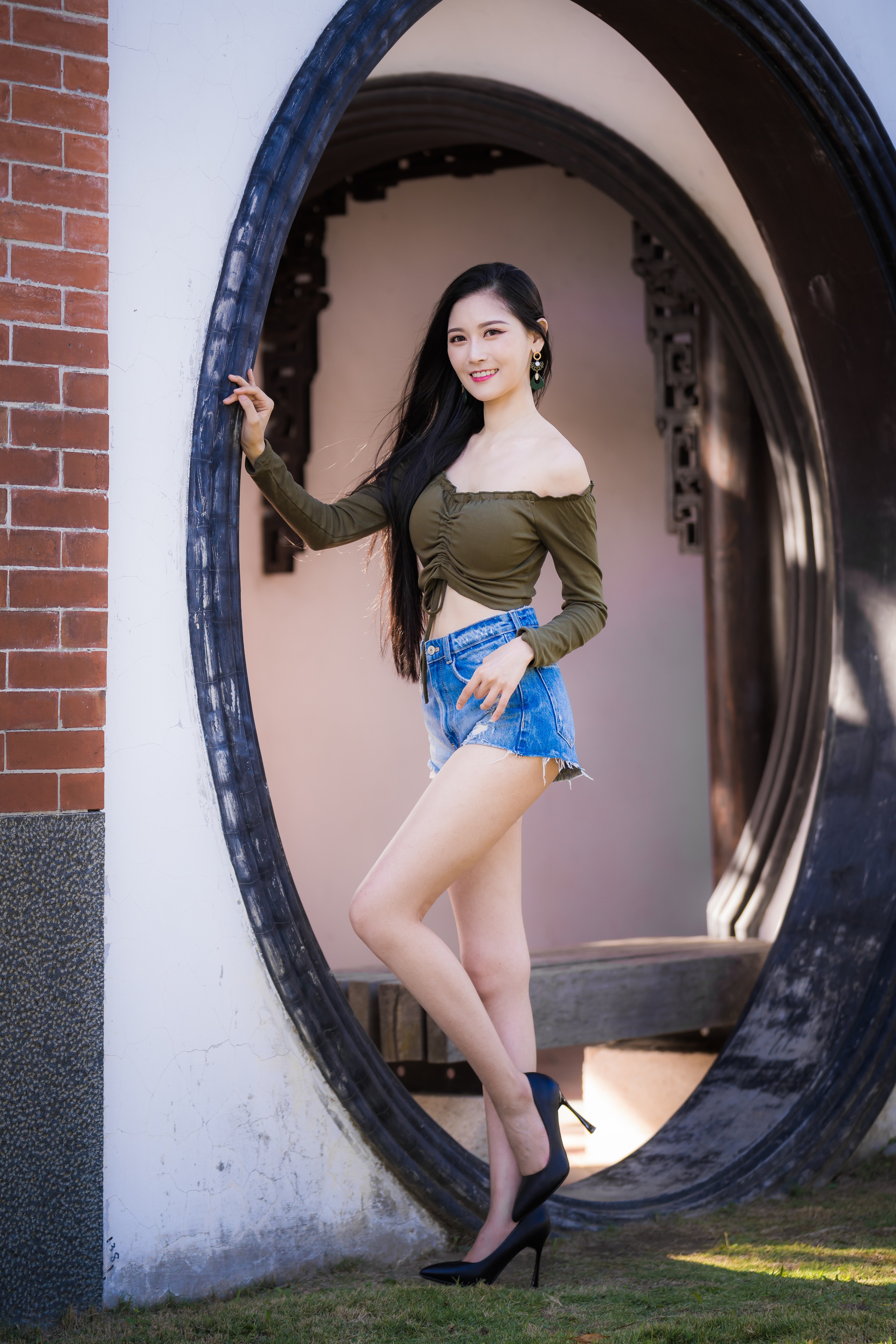 Asian woman in shorts and off-the-shoulder top posing HD Phone Wallpaper