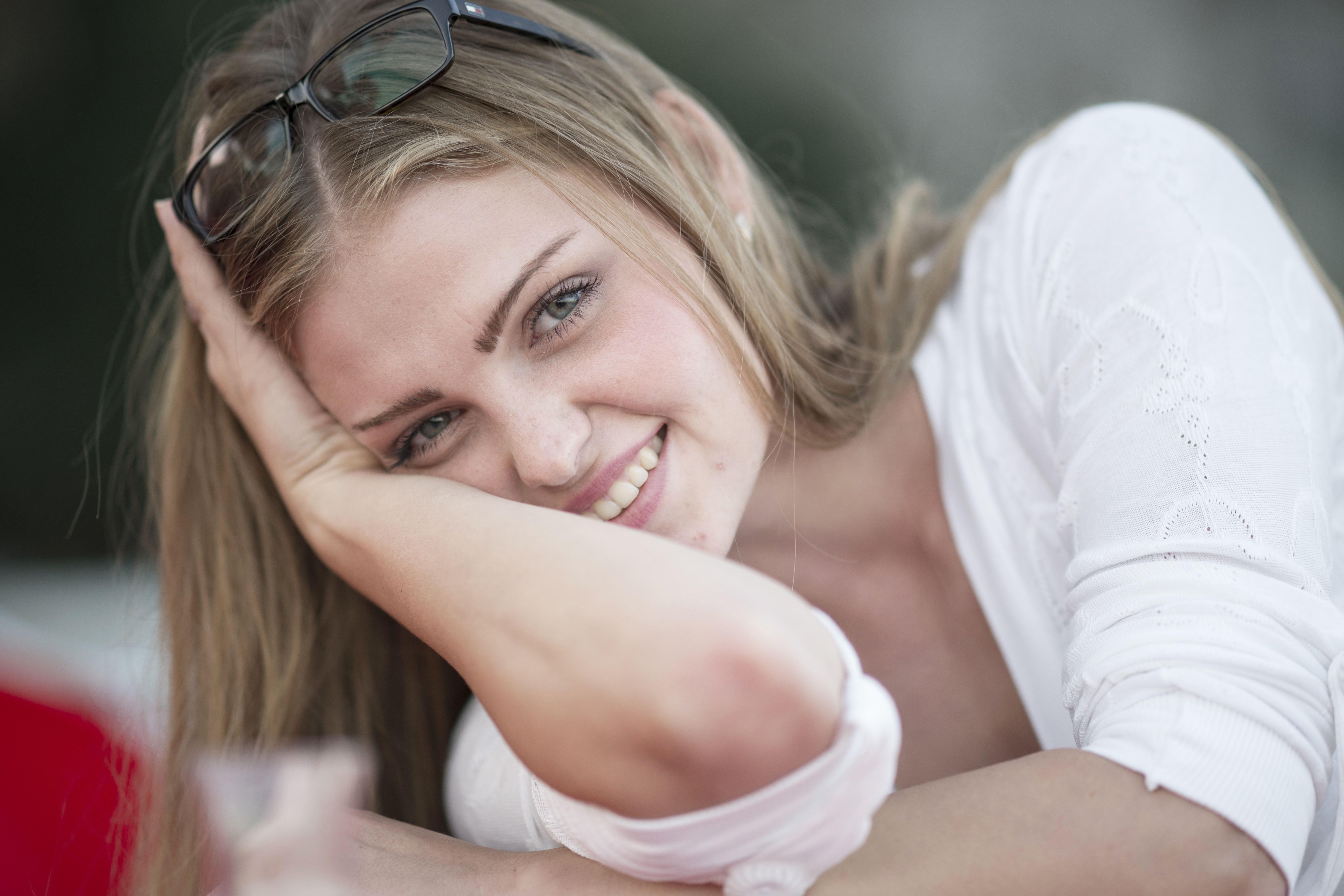 Woman with glasses smiling HD Wallpaper