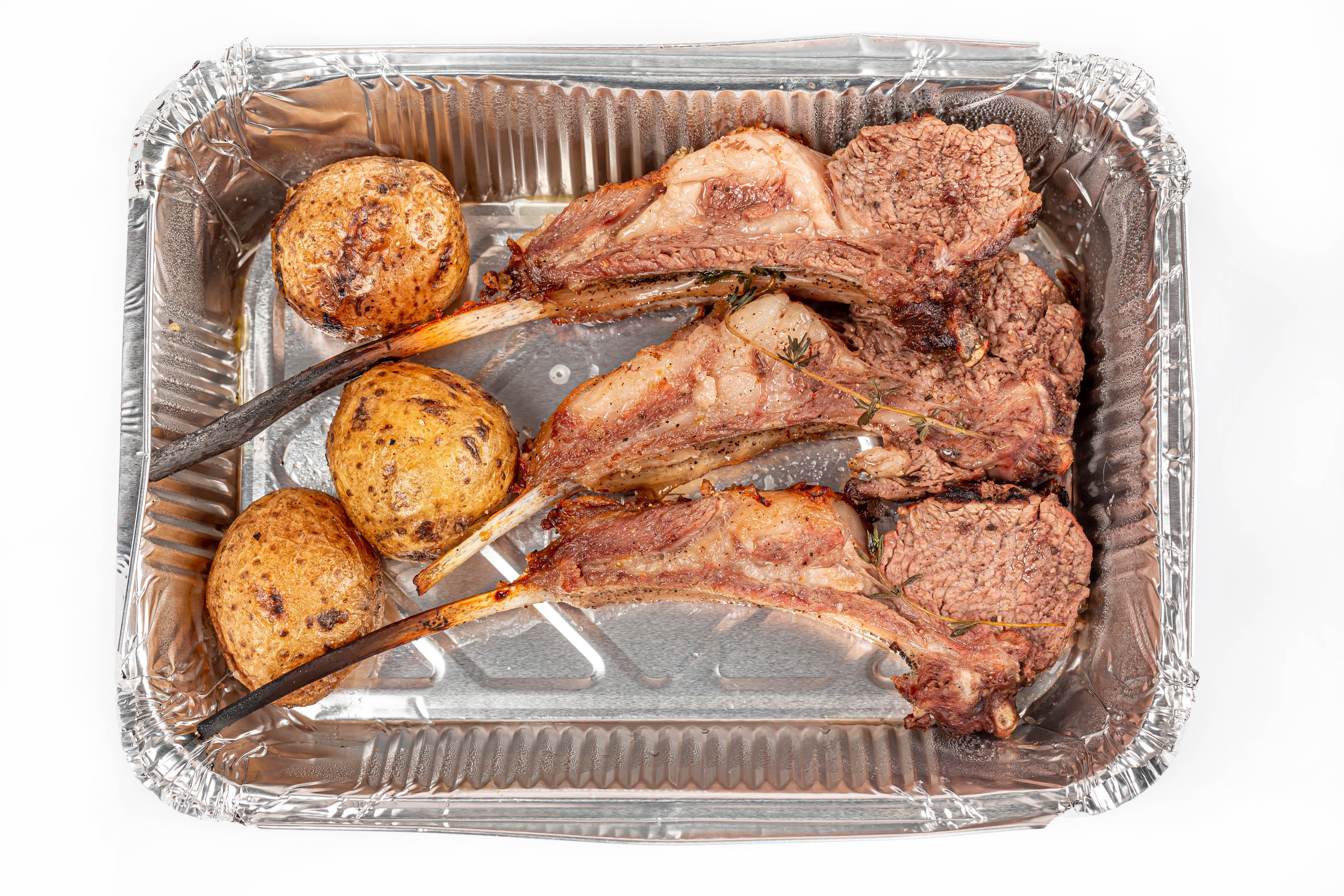 Rack of Lamb with Roasted Potatoes in Foil Pan HD Wallpaper