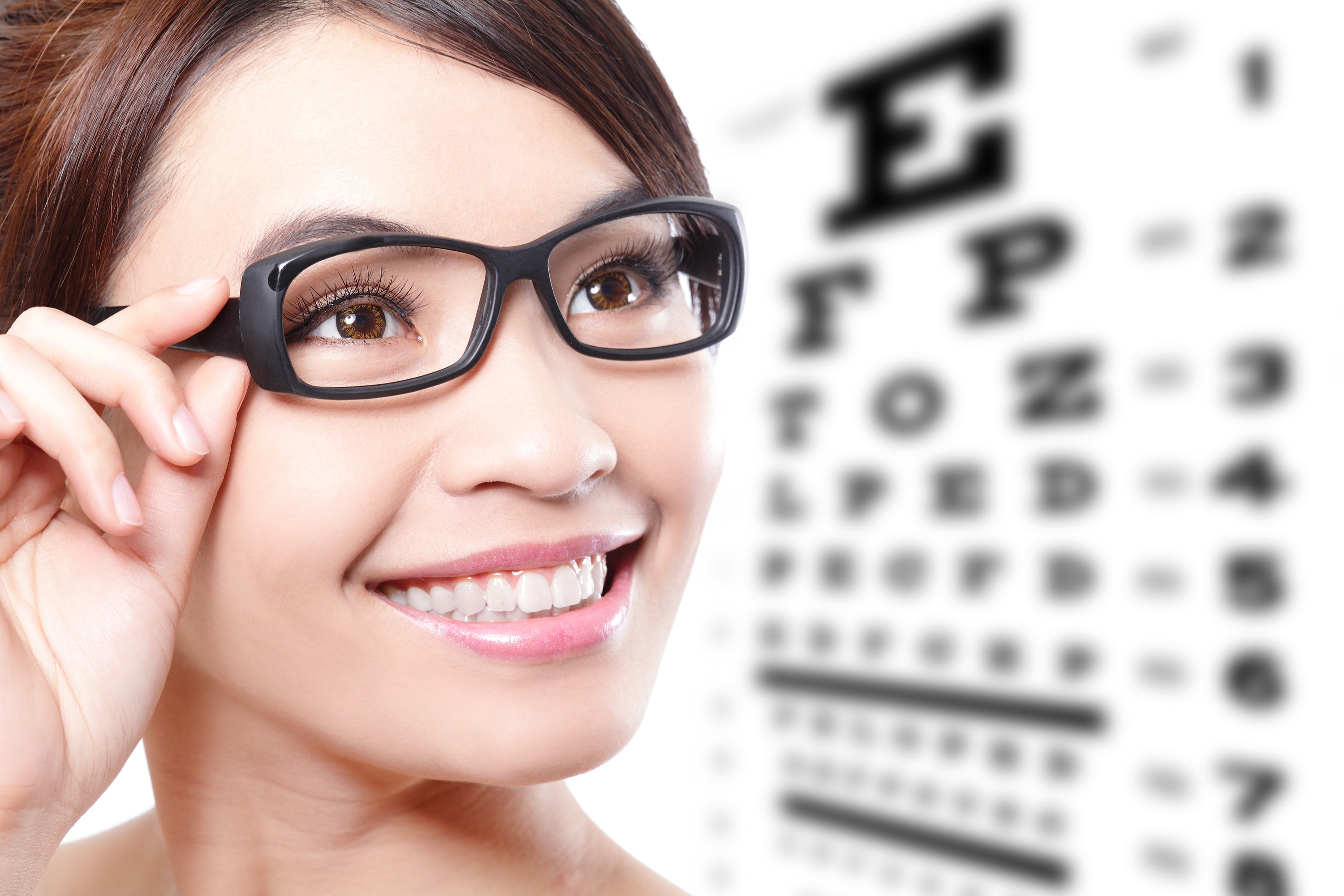 Woman wearing glasses at eye exam HD Wallpaper