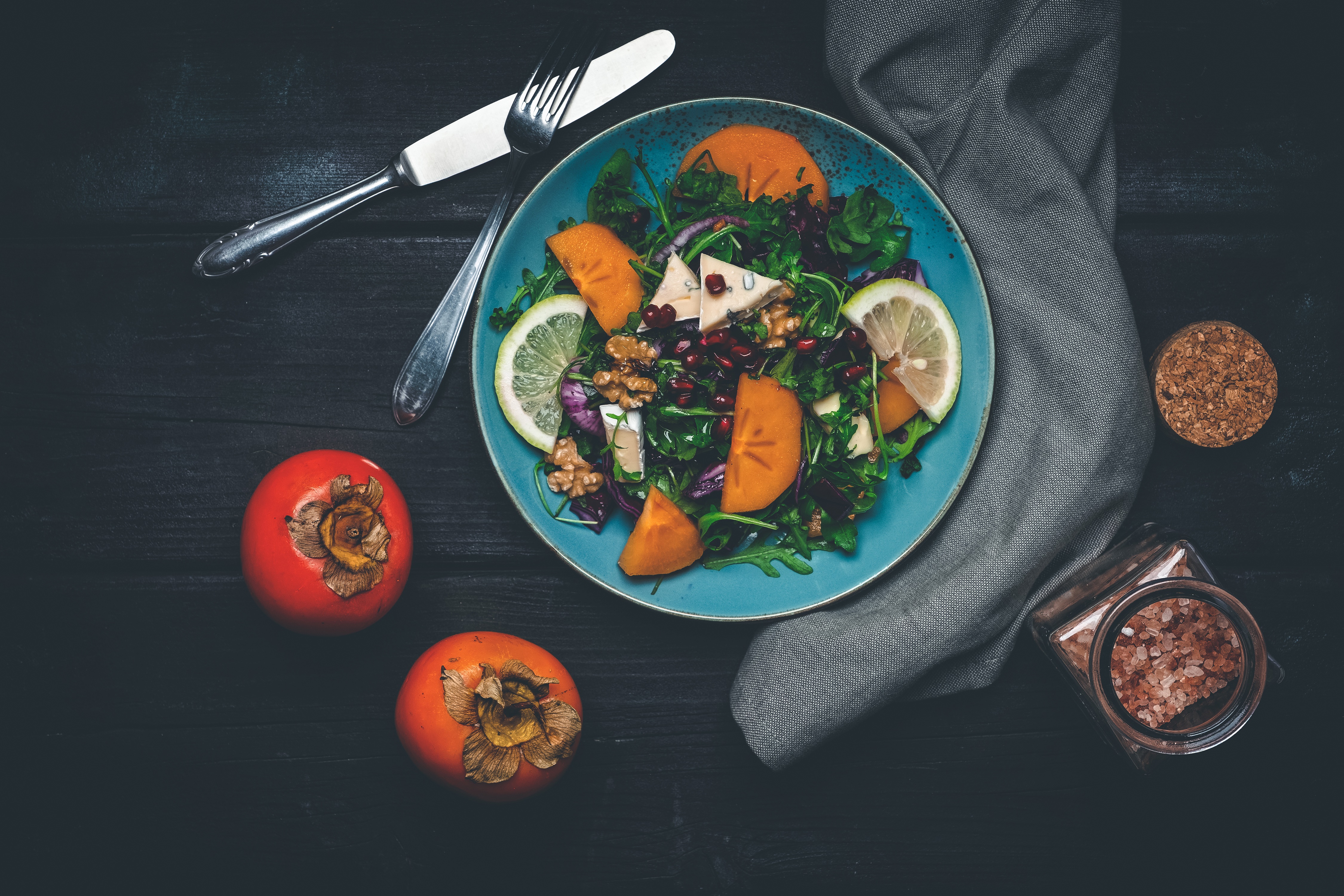Salad with Persimmon, Cheese, and Walnuts on a Plate HD Wallpaper
