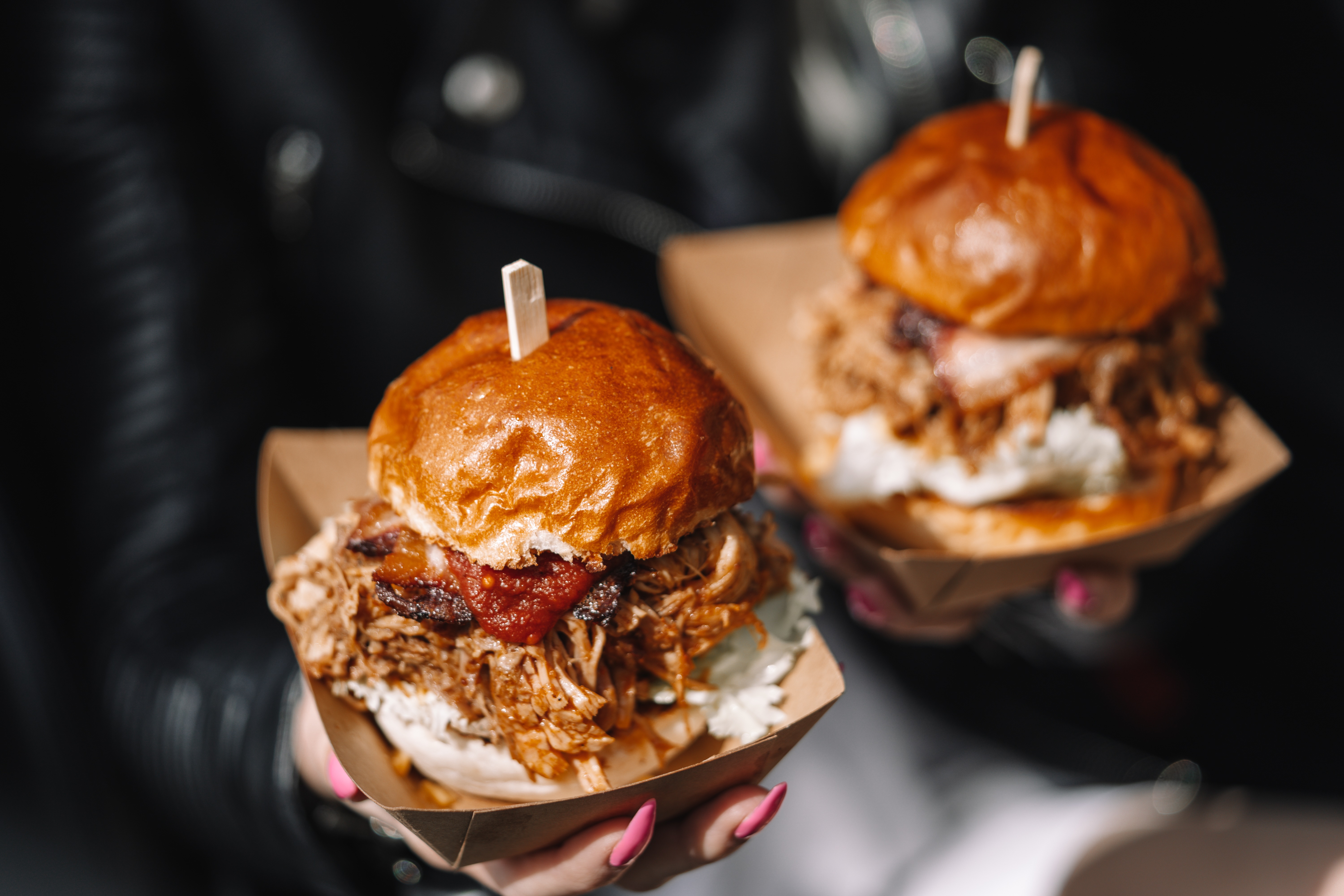 Two pulled pork burgers with sauce and coleslaw HD Wallpaper