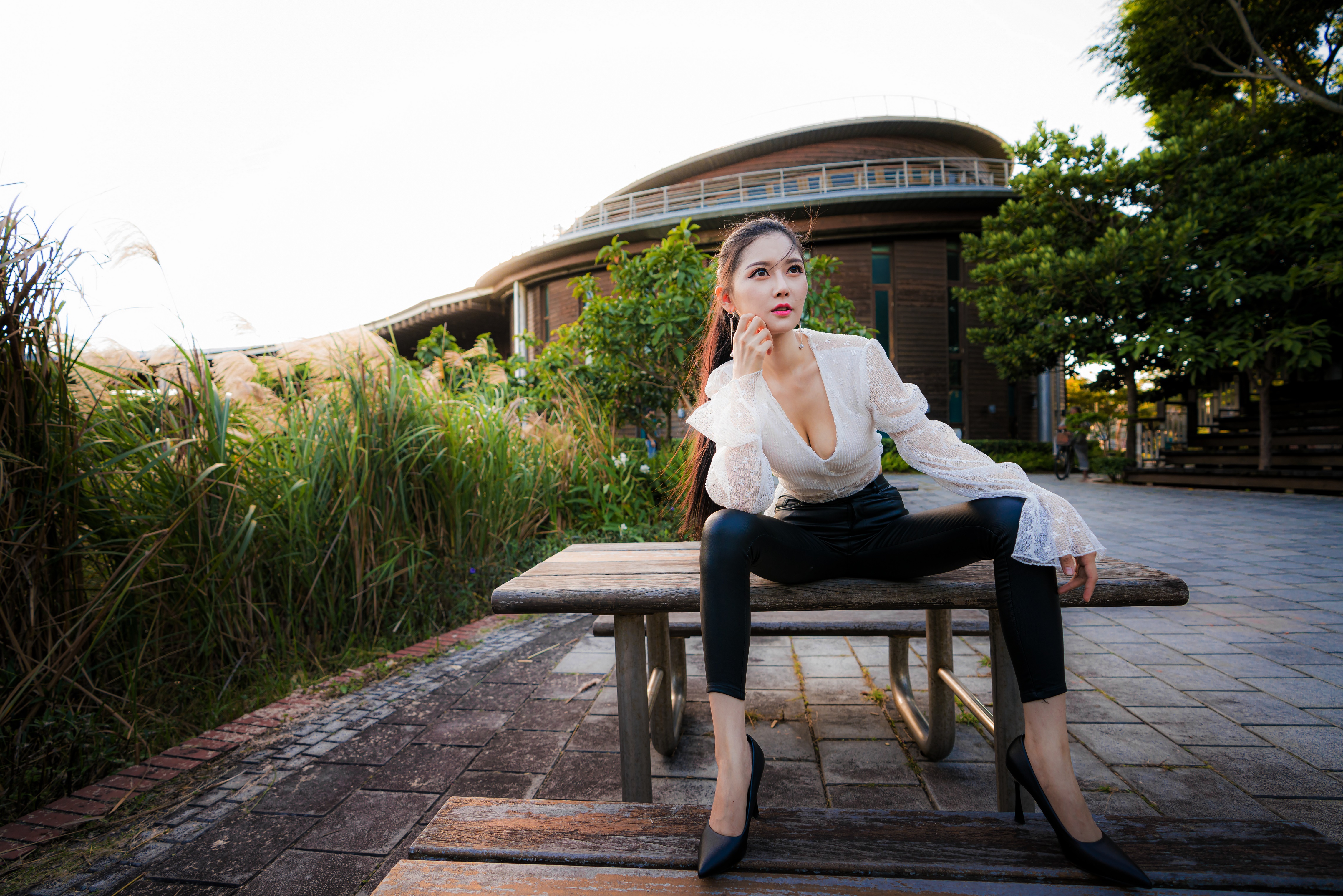 Asian woman in blouse and stilettos posing on bench HD Wallpaper
