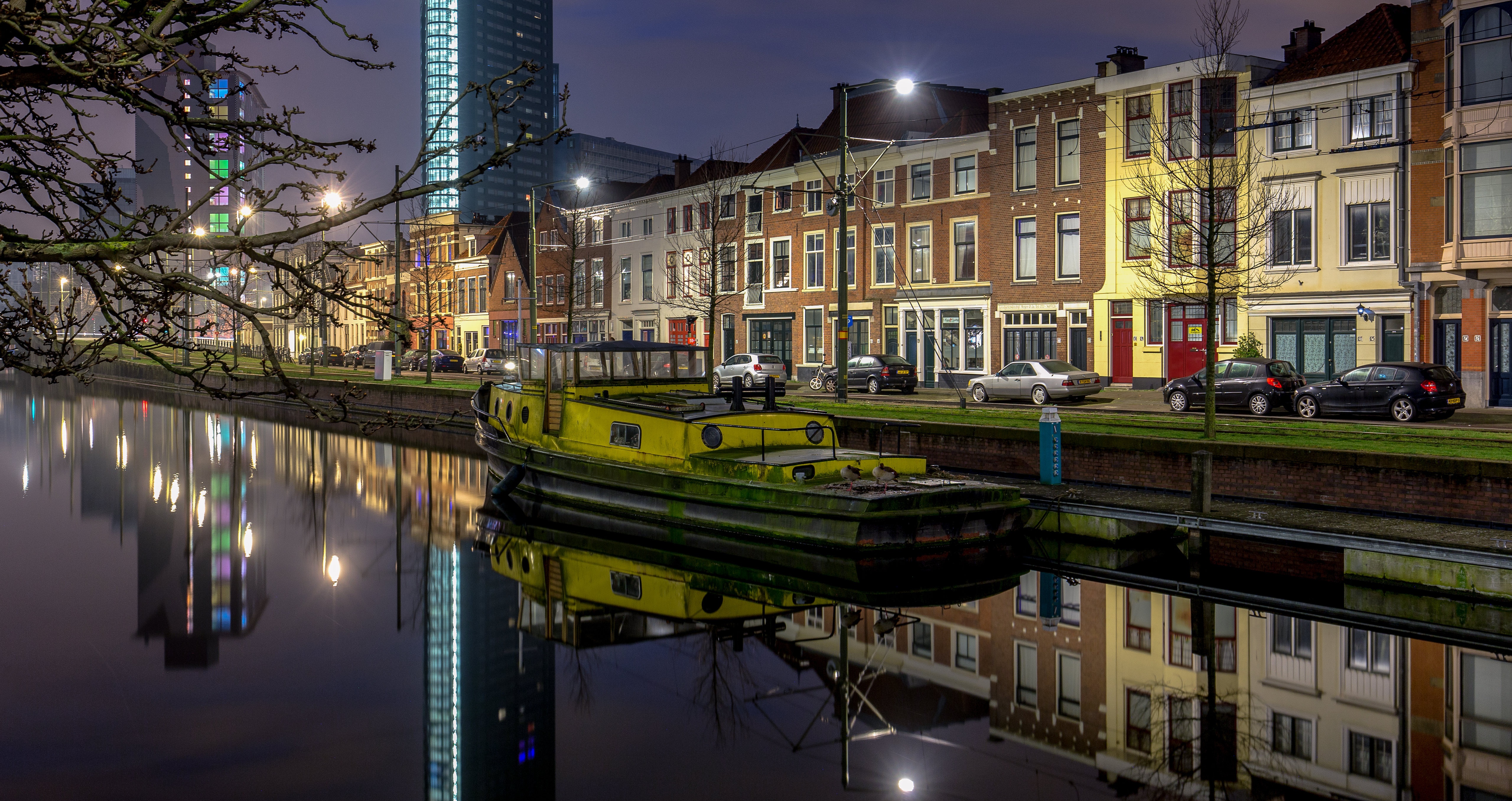 Riverboat on canal in The Hague, Netherlands at night HD Wallpaper