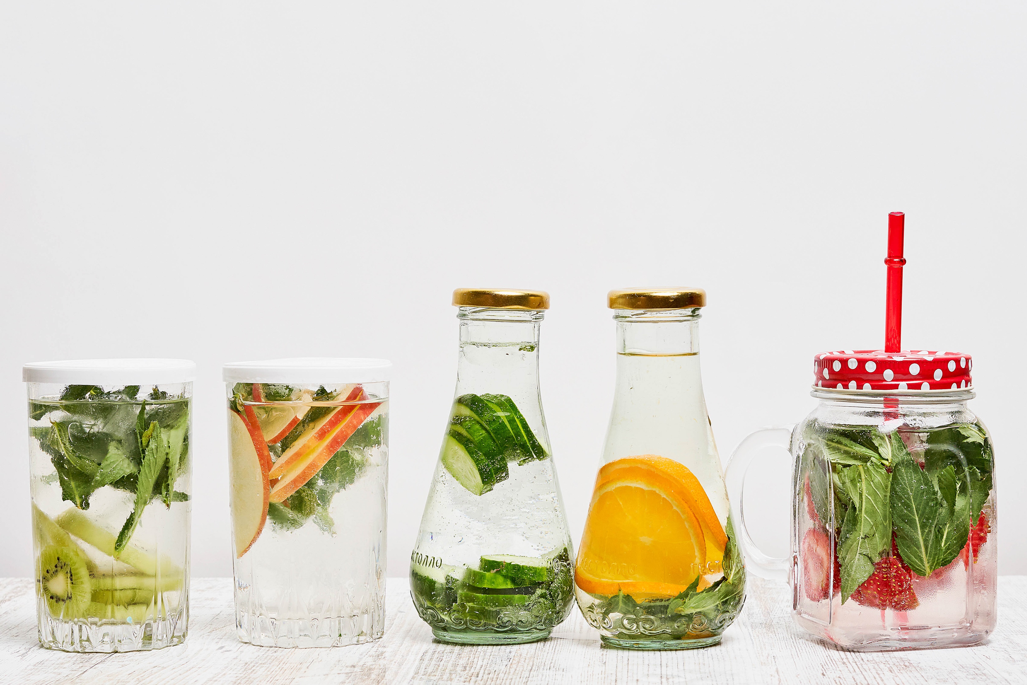 Infused water in glasses and bottles HD Wallpaper