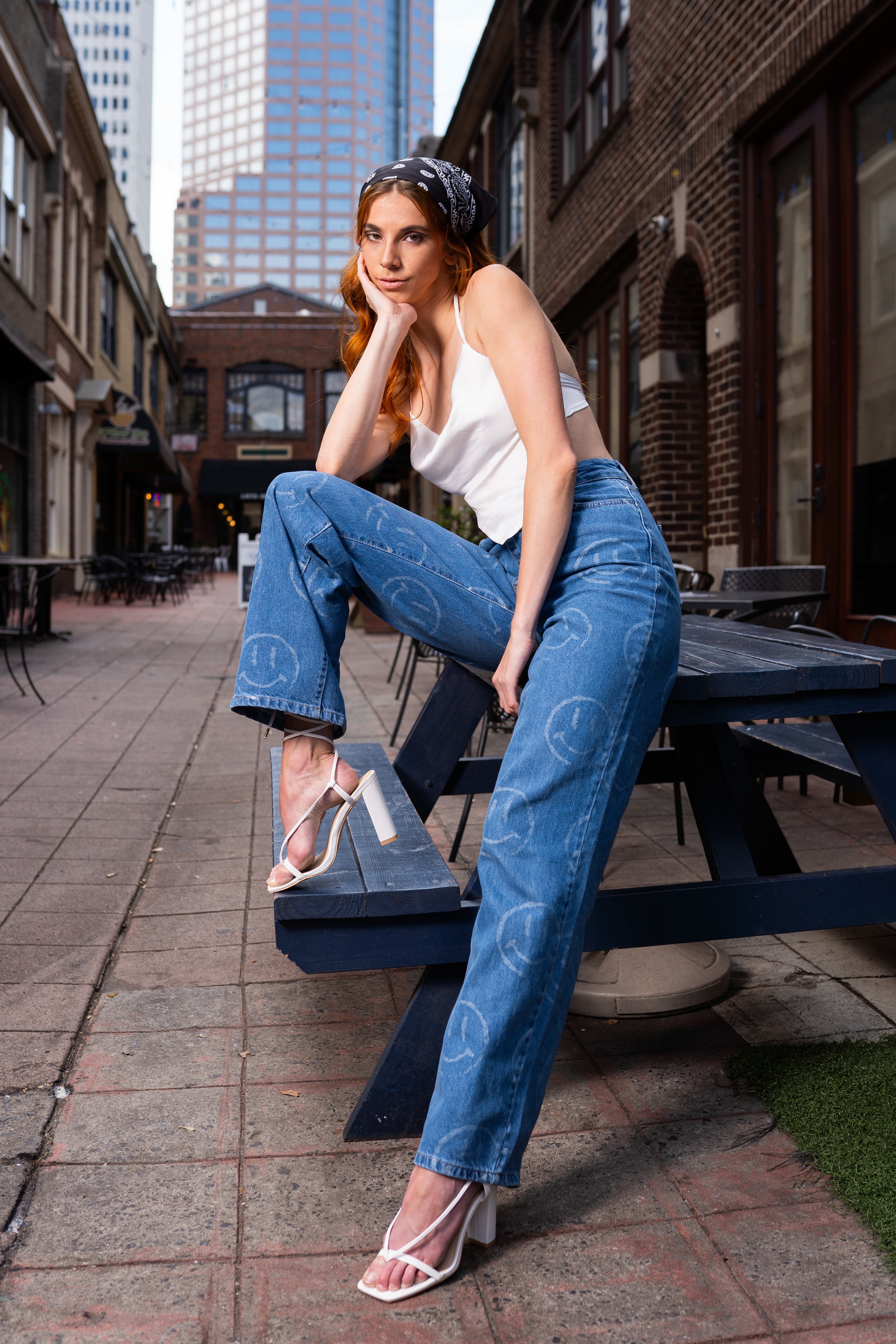 Redhead girl in jeans and singlet posing HD Phone Wallpaper