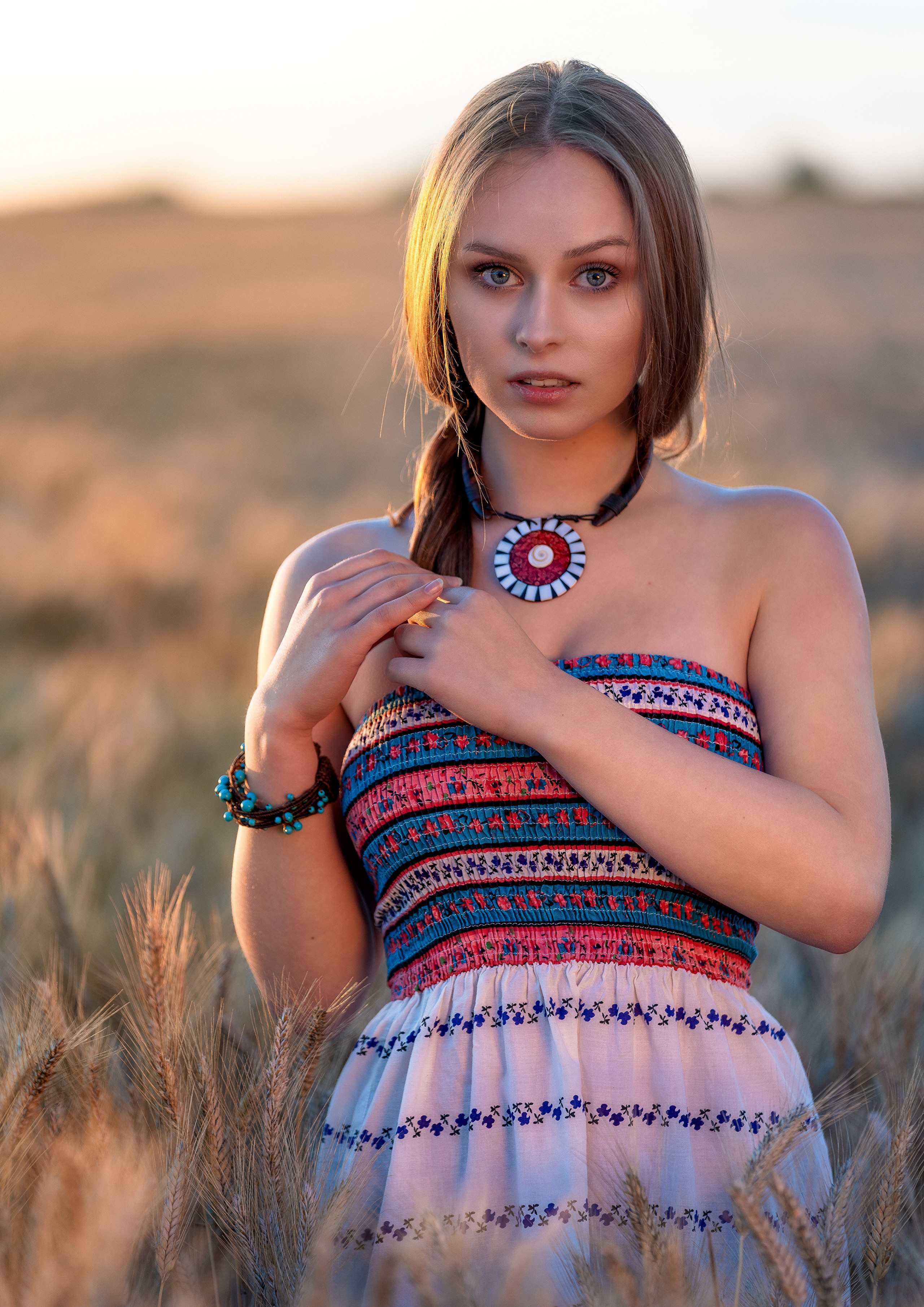 Emilia Piotrowska in a field at sunset HD Phone Wallpaper