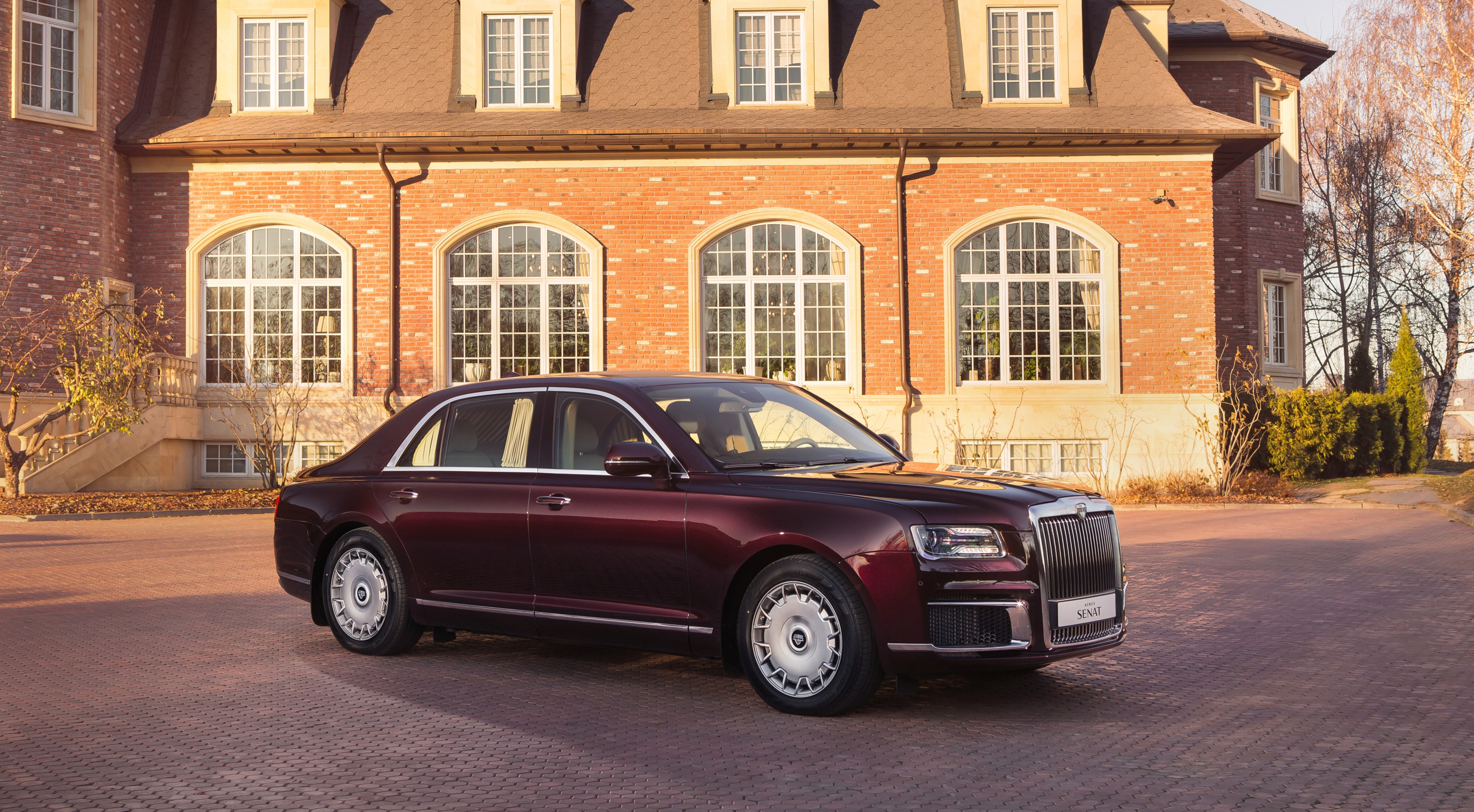 Aurus Senat S600 Sedan parked in front of a brick house HD Wallpaper