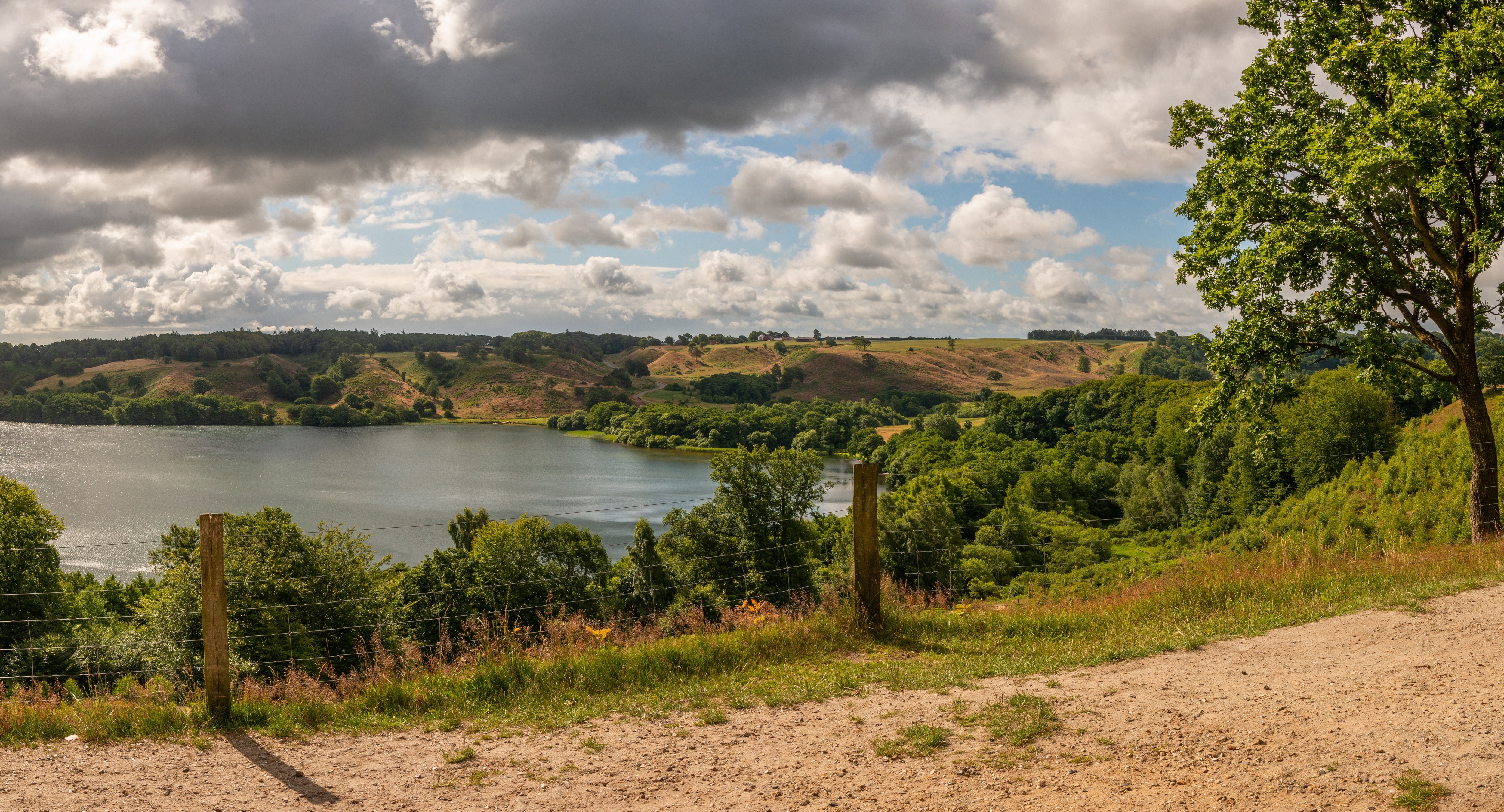 Lake and rolling hills in Viborg, Denmark HD Wallpaper