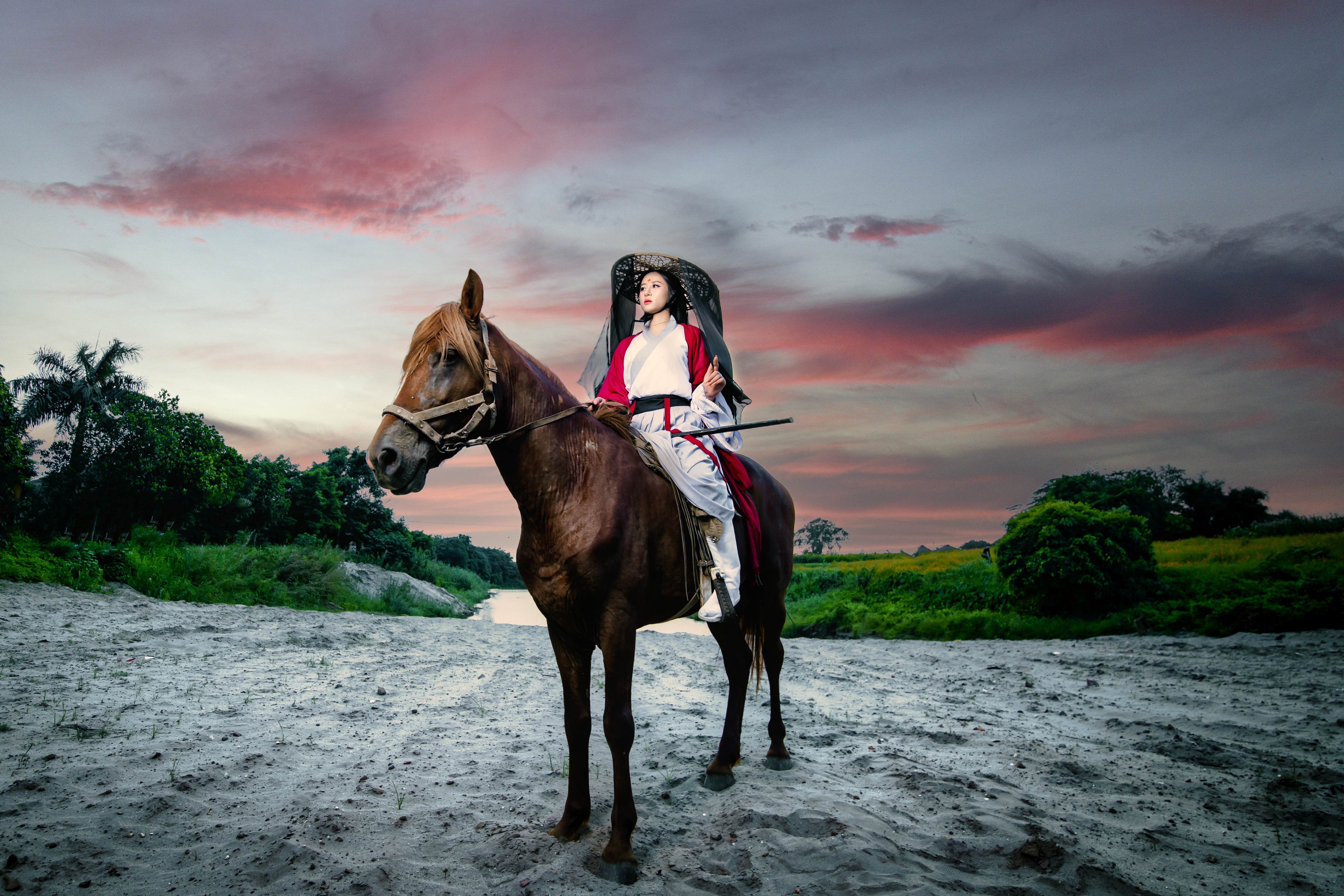 Woman in traditional Asian attire riding a horse HD Wallpaper