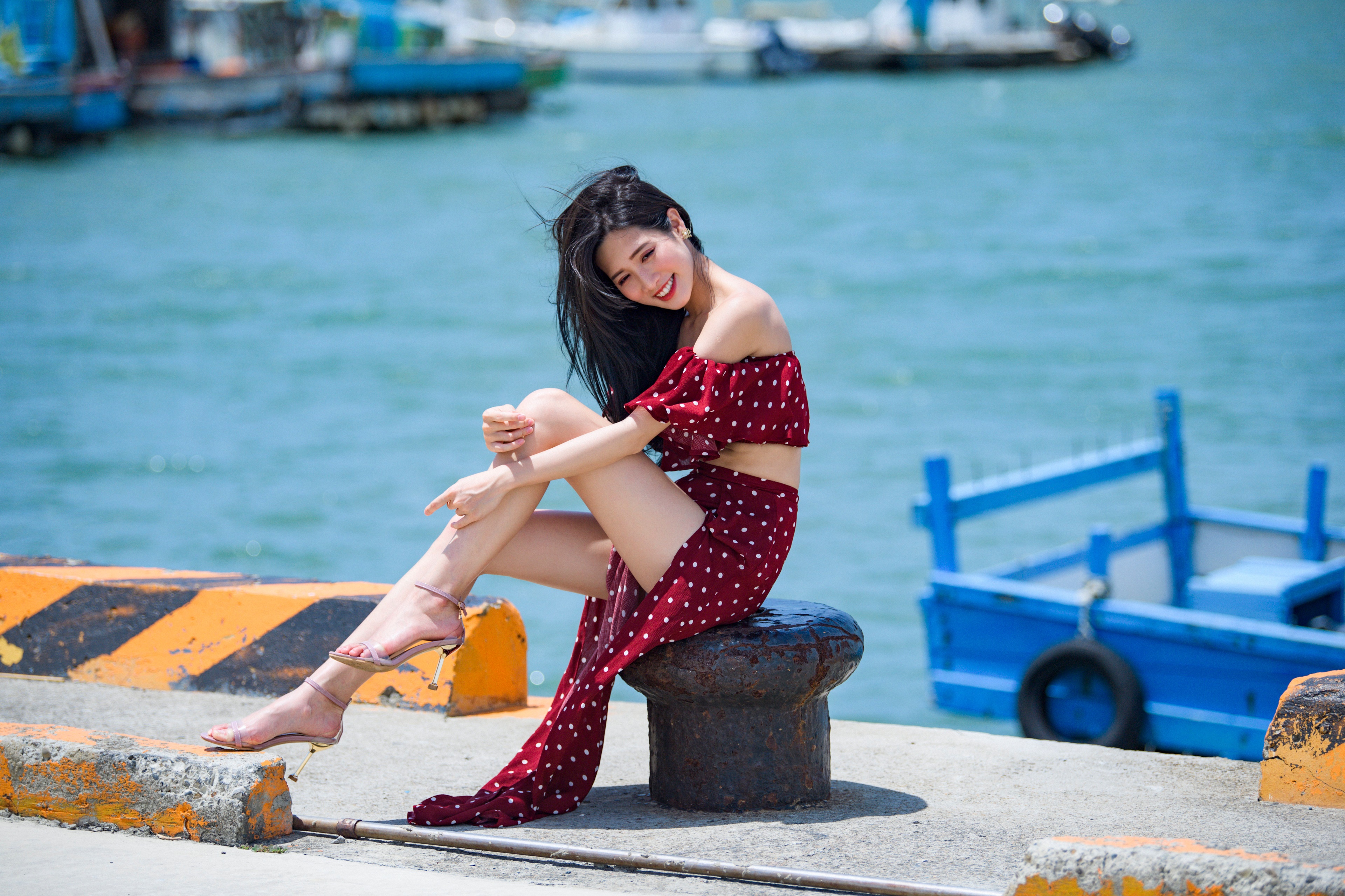 Asian girl sitting on a pier HD Wallpaper